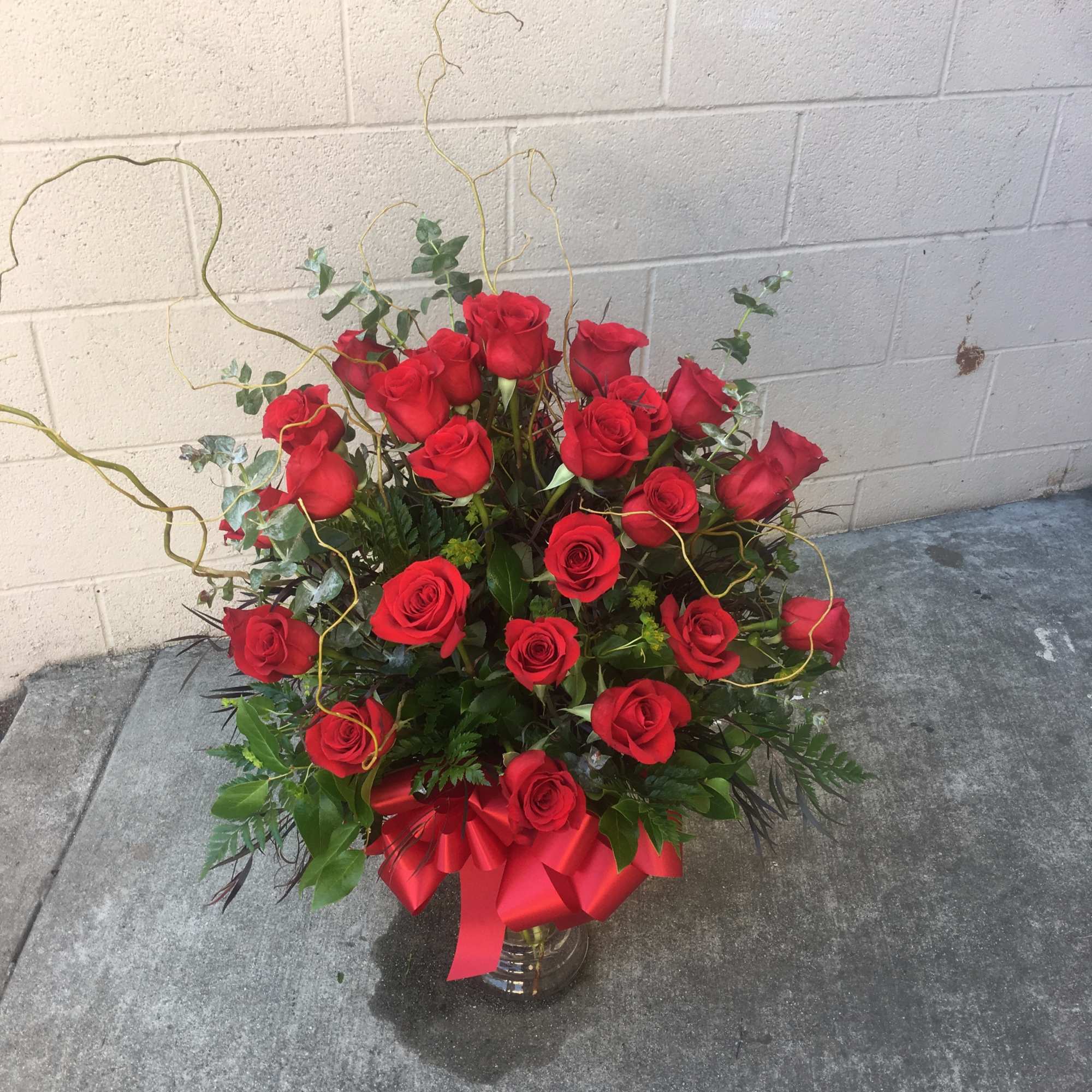 Two dozen beautiful red roses.