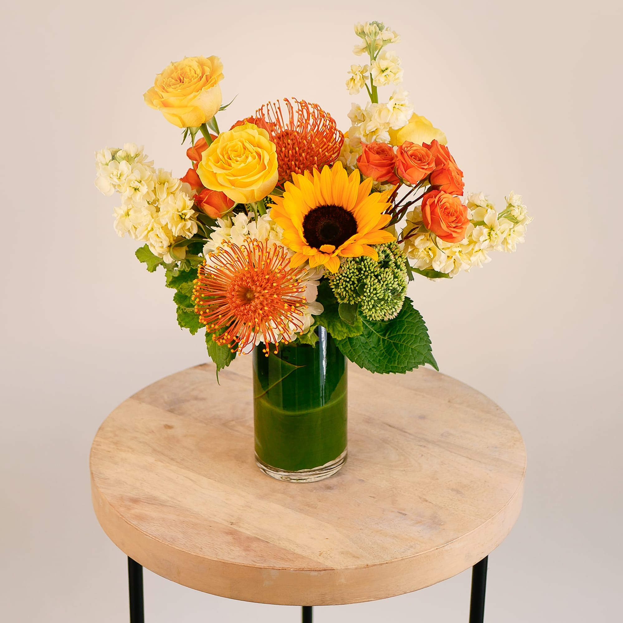 Brighten any space with this radiant mix of sunny yellow roses, bold