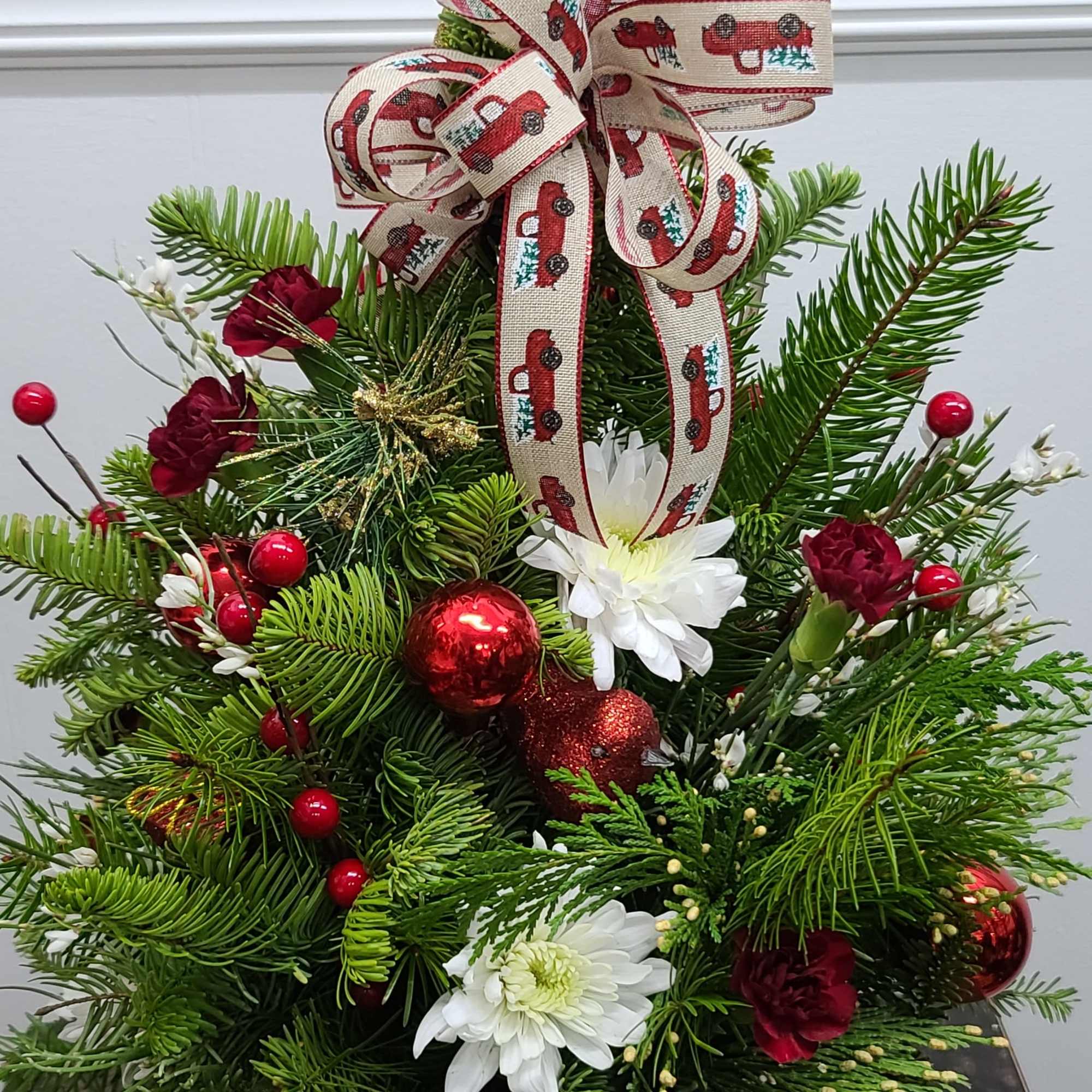 An endearing fresh pine Christmas tree made from a mix of fresh