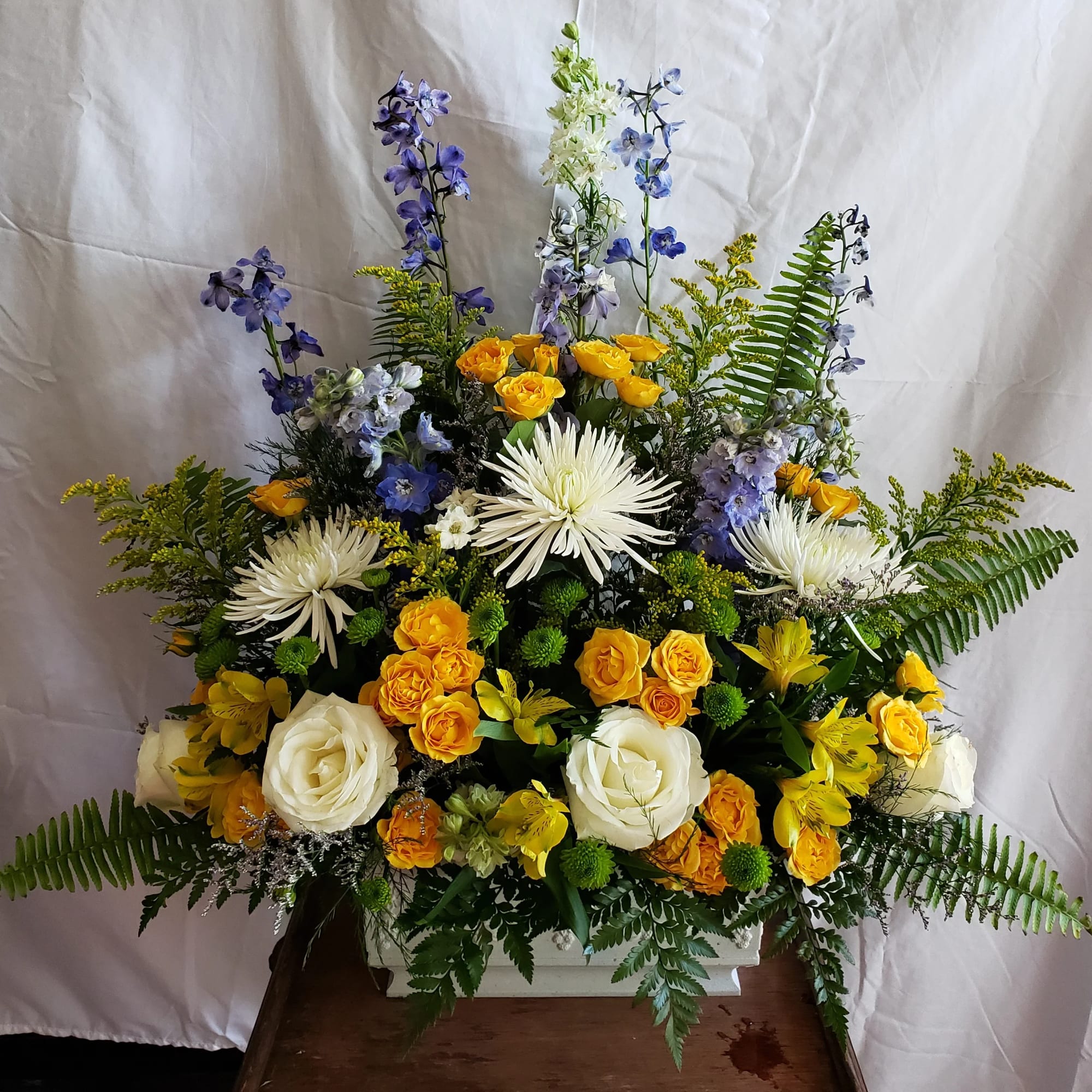 Vibrant Purples and Pinks pop against gorgeous mixed greens. Long lasting carnations