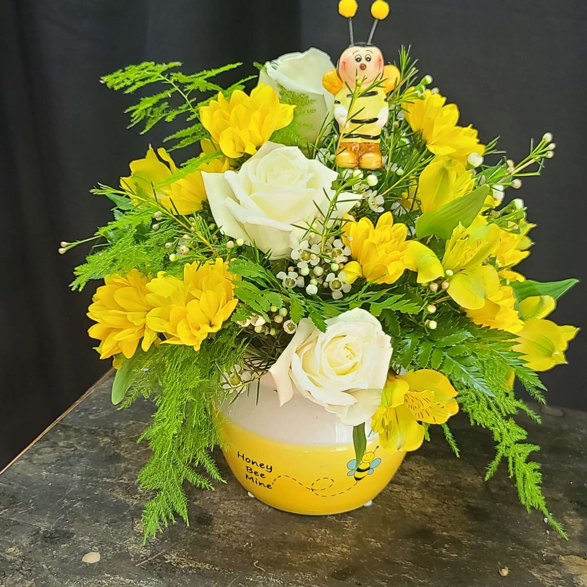 This super cute honey bee ceramic pot is filled with bright sunny