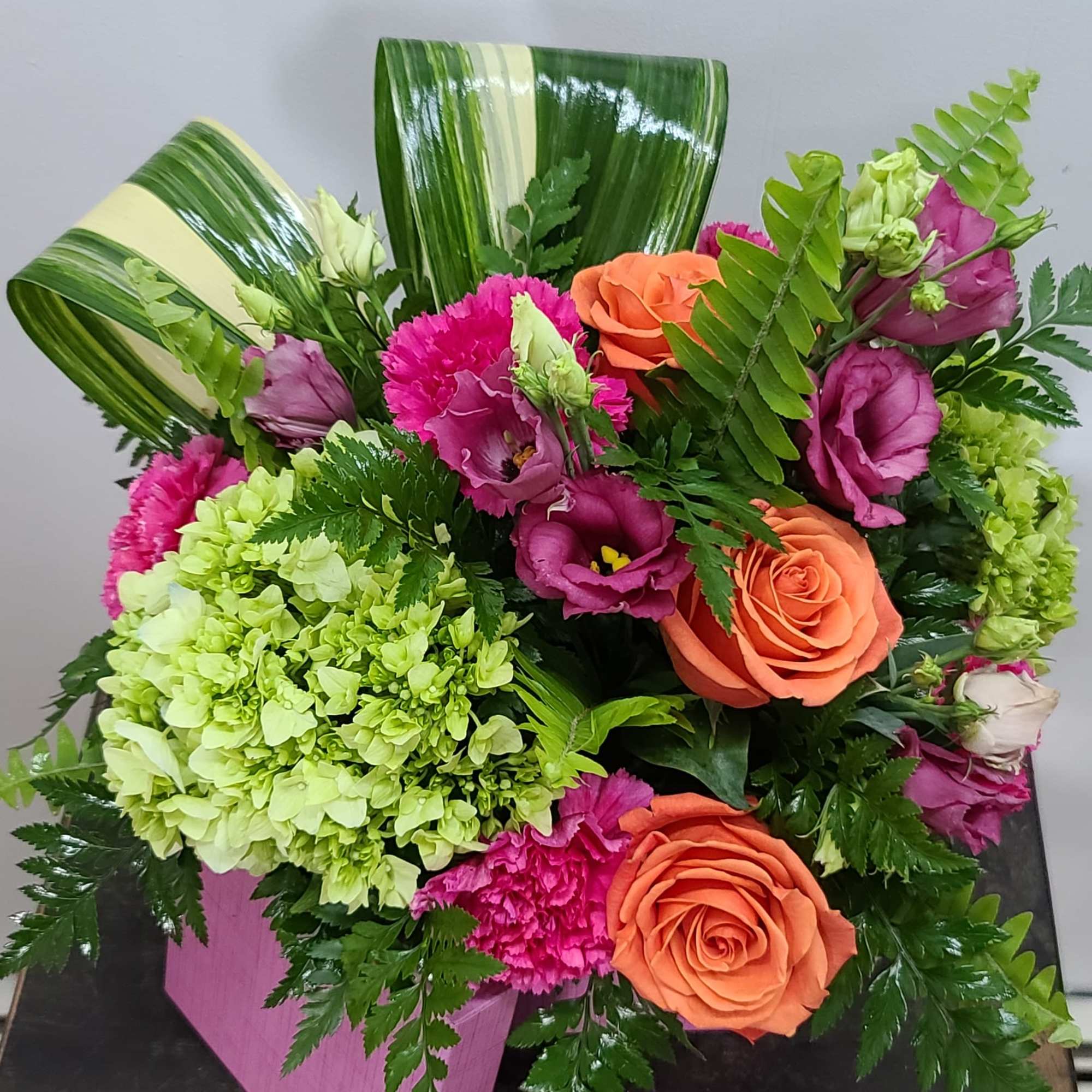 Bright, bold colors of orange, green and hot pink evoke thoughts of