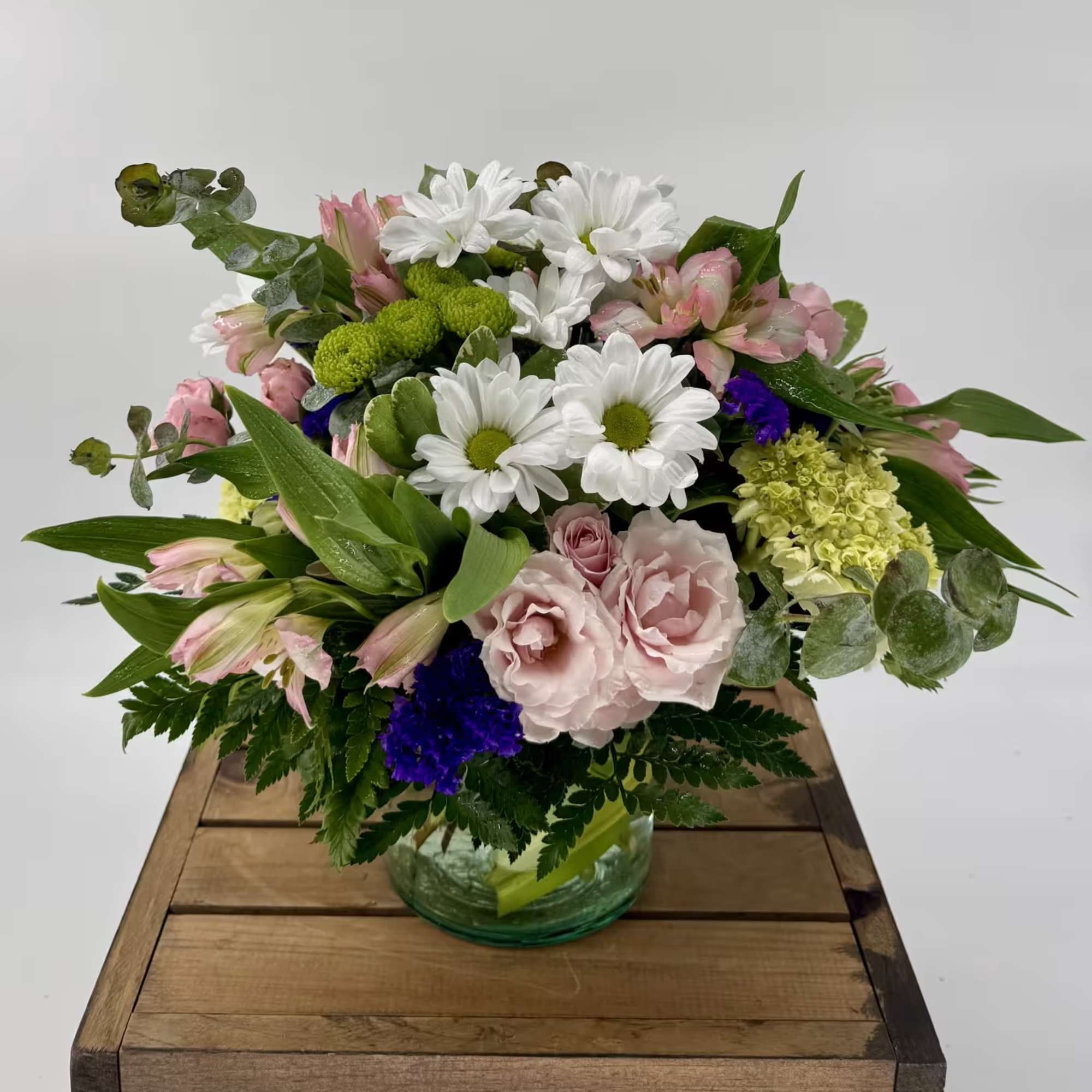 Our charming Fluttering Light flower arrangement, filled with green hydrangea, pink spray
