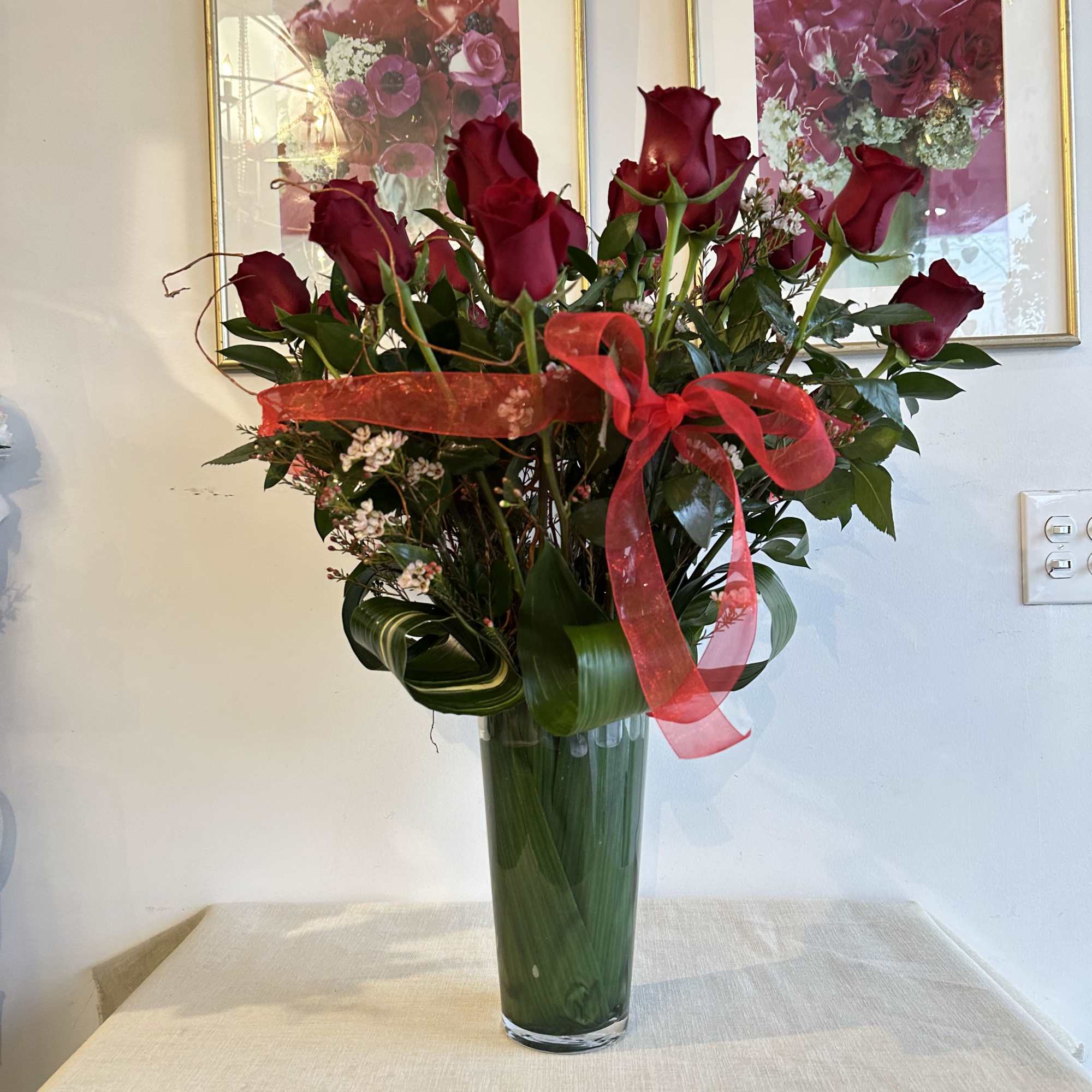 these classic arrangements, accented with seasonal foliage, are available in three stunning