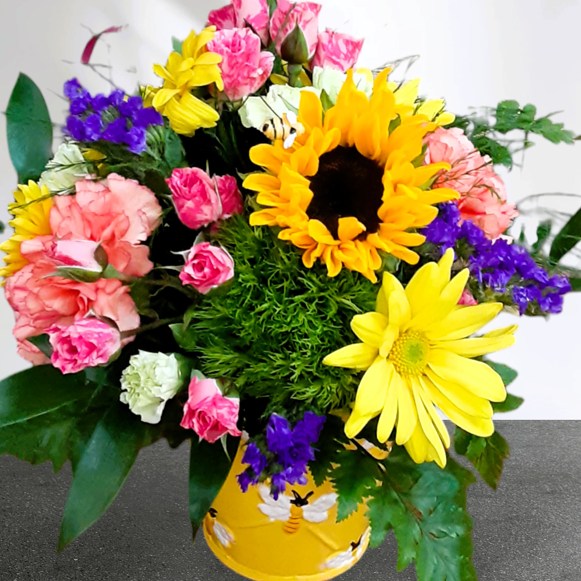 Lift their spirits with our BEE WELL, MY FRIEND bucket bouquet. Each