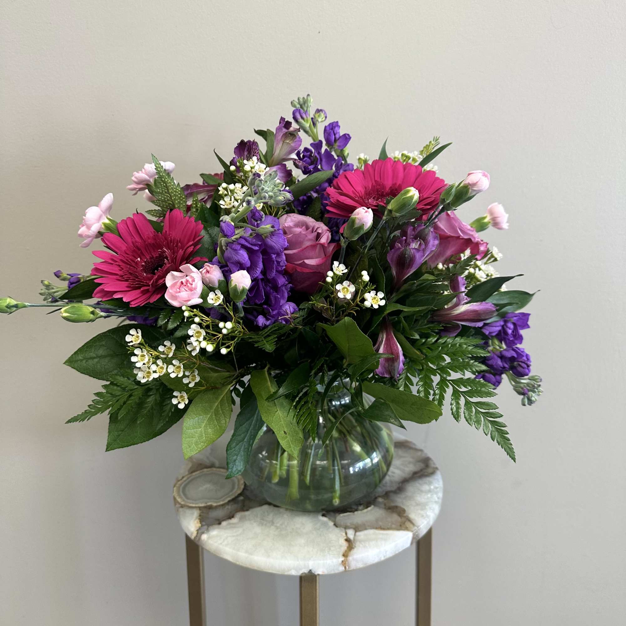 A delightful pink and lavender mix of roses, alstroemeria, hot pink gerbera