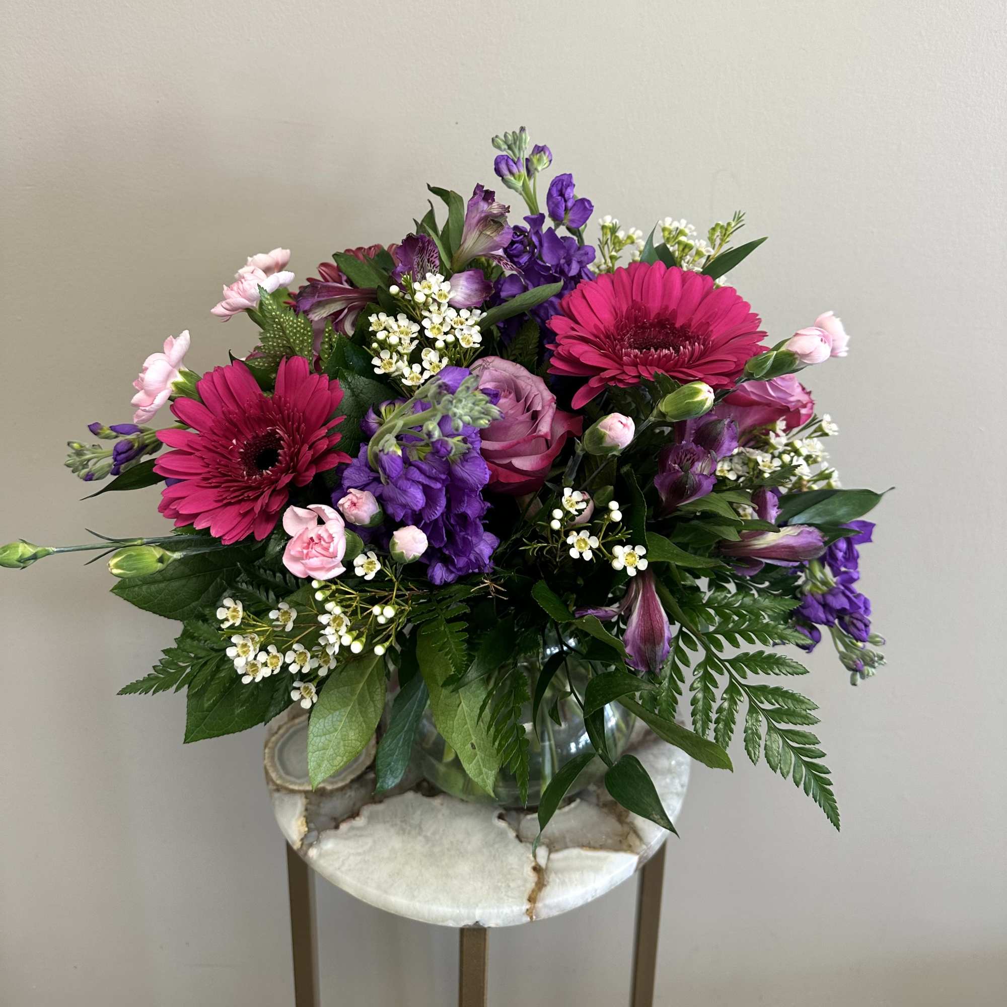 A delightful pink and lavender mix of roses, alstroemeria, hot pink gerbera