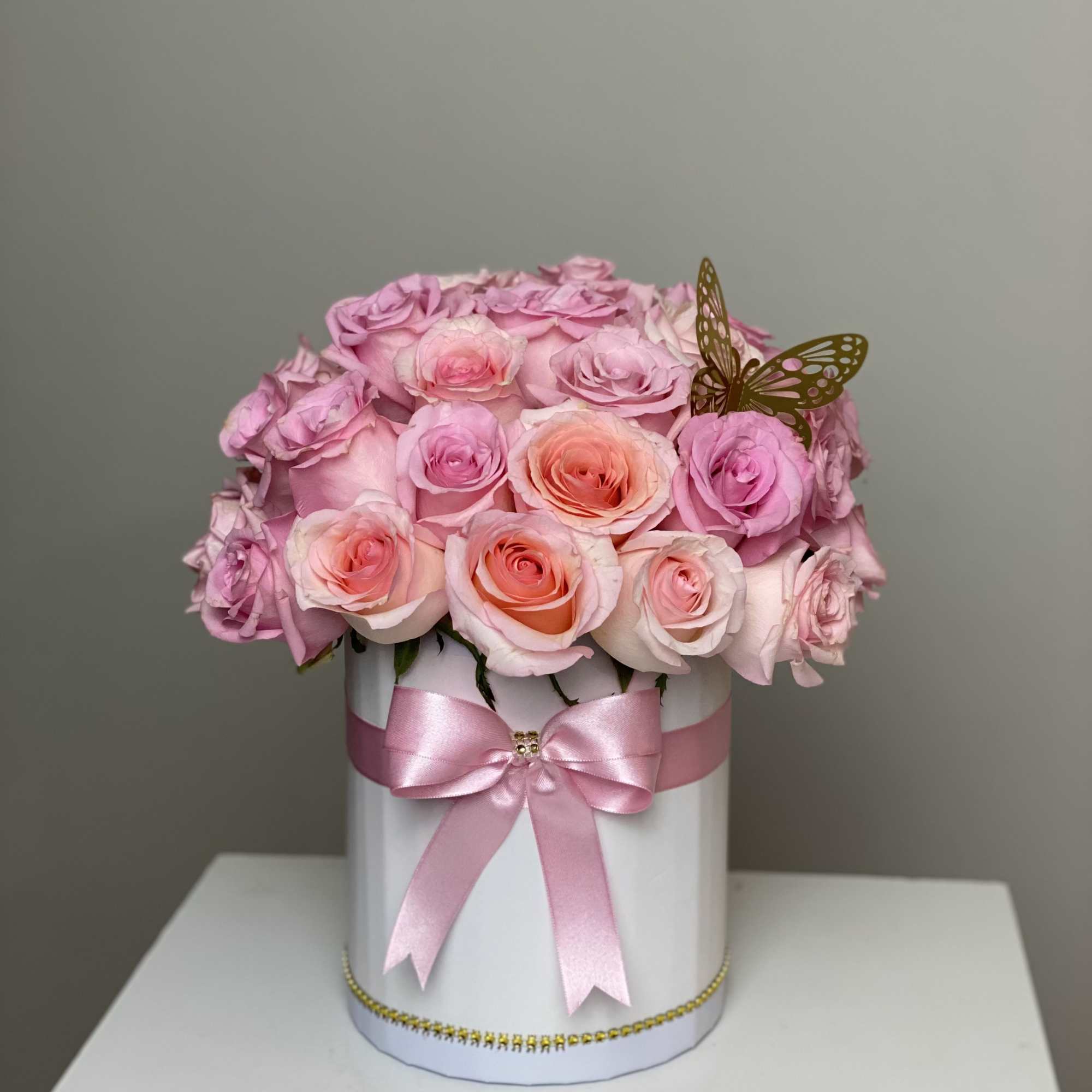Beautiful floral arrangement with roses in light tones that inspire calm and
