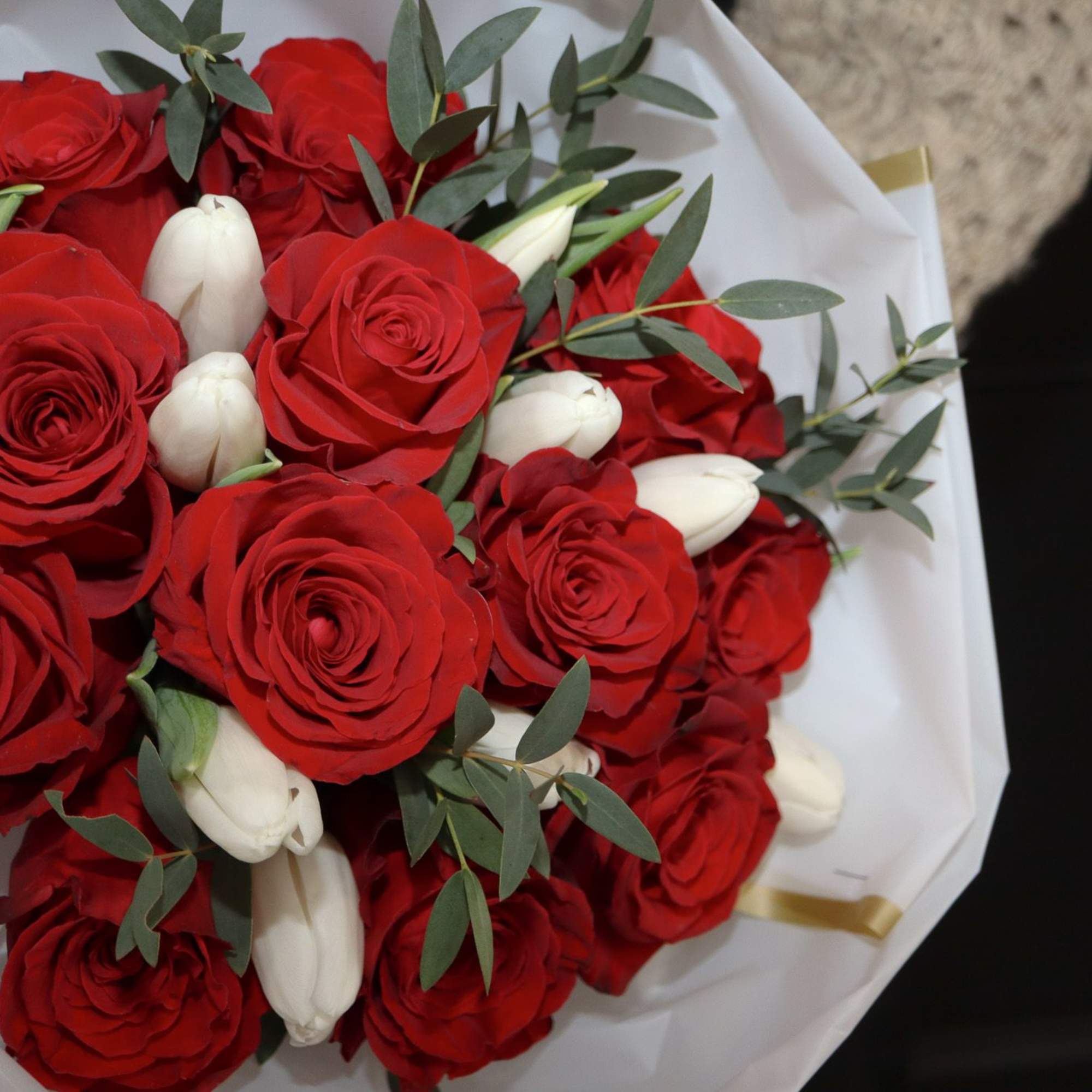 A simple and elegant of 12 red roses and 10 white tulips.