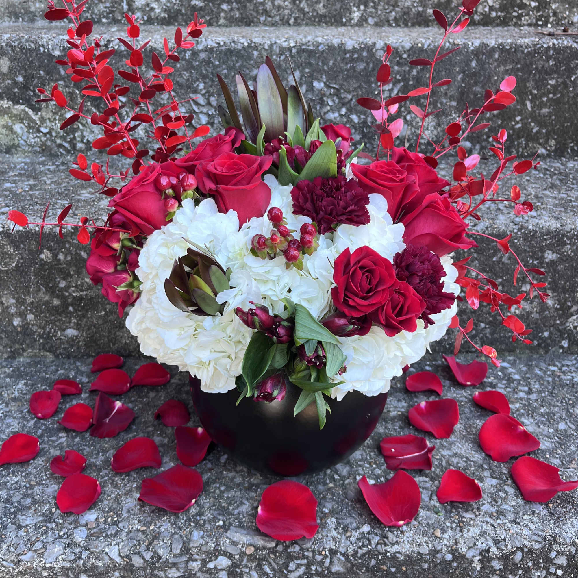 This beautifully designed arrangement is filled with hydrangea, roses, carnations, spray roses