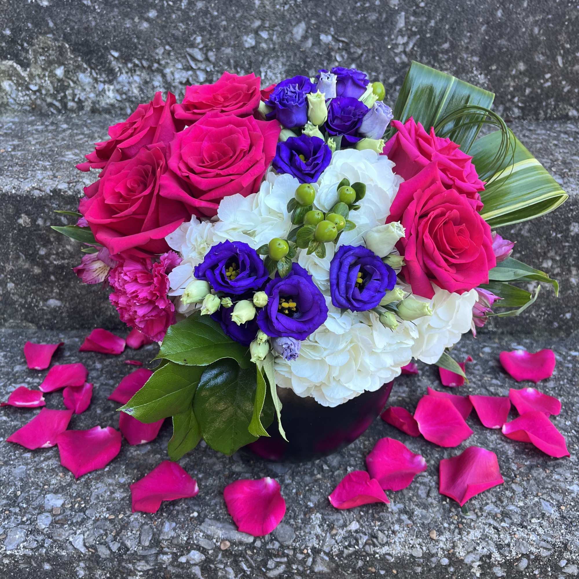 This beautifully designed arrangement is filled with hydrangea, roses, Lisianthus, Hypericum, aspidistra