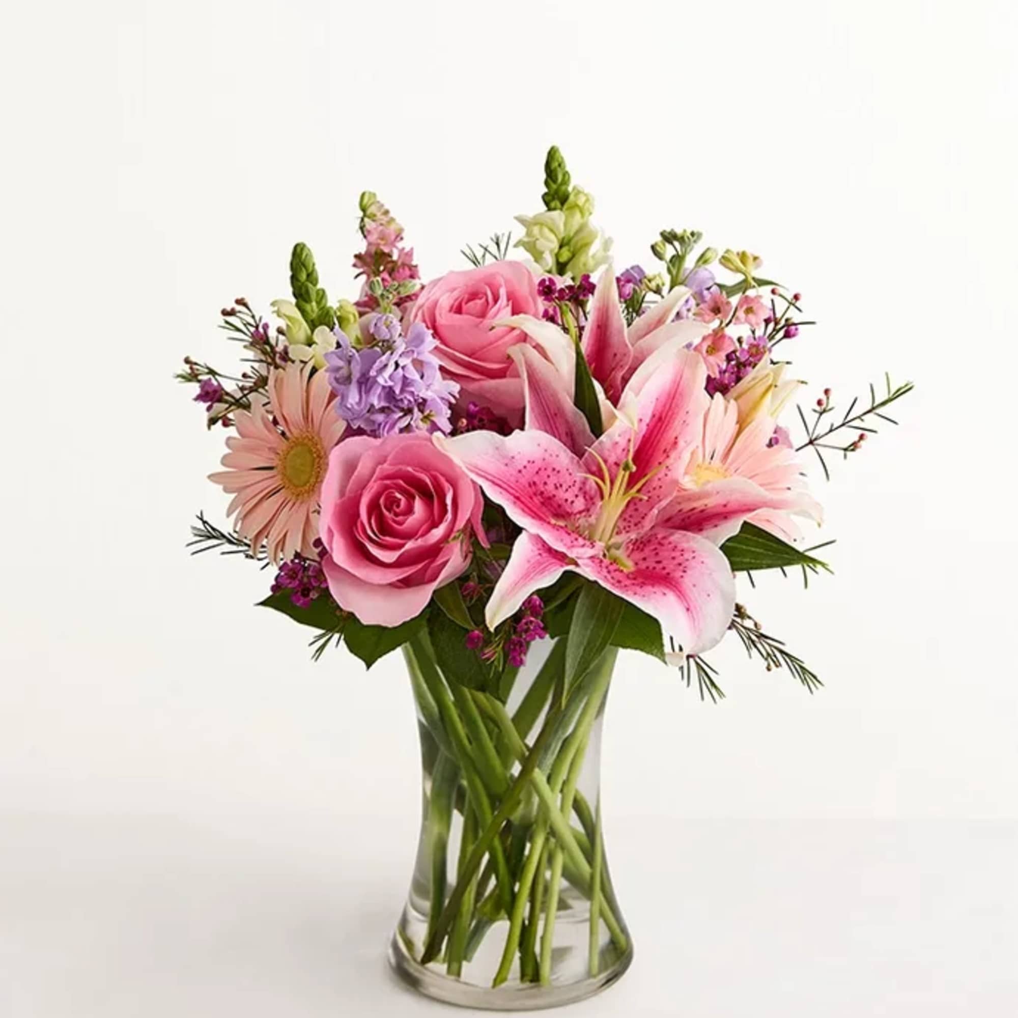 All-around arrangement with pink roses, Oriental lilies, Gerbera daisies and larkspur; white