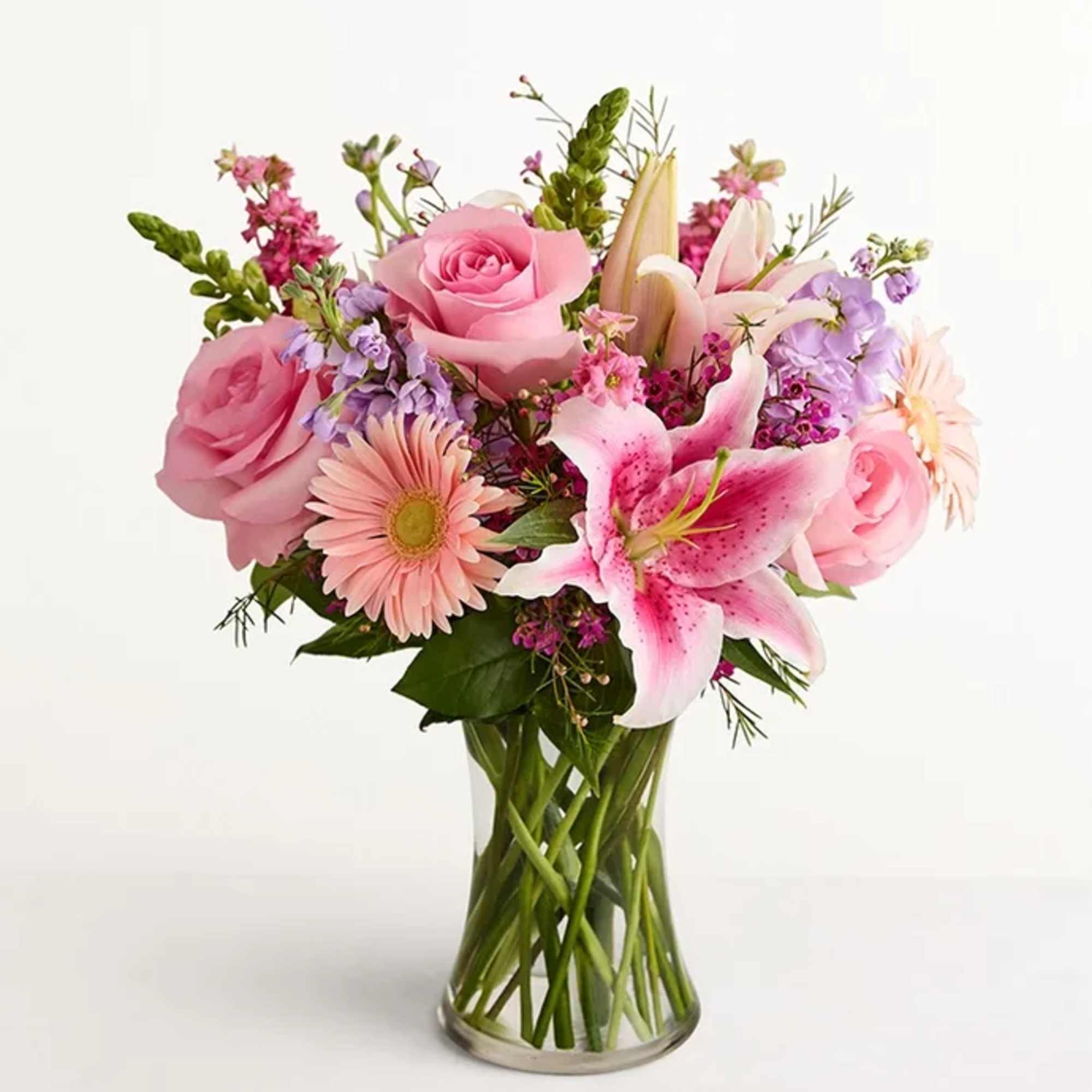 All-around arrangement with pink roses, Oriental lilies, Gerbera daisies and larkspur; white