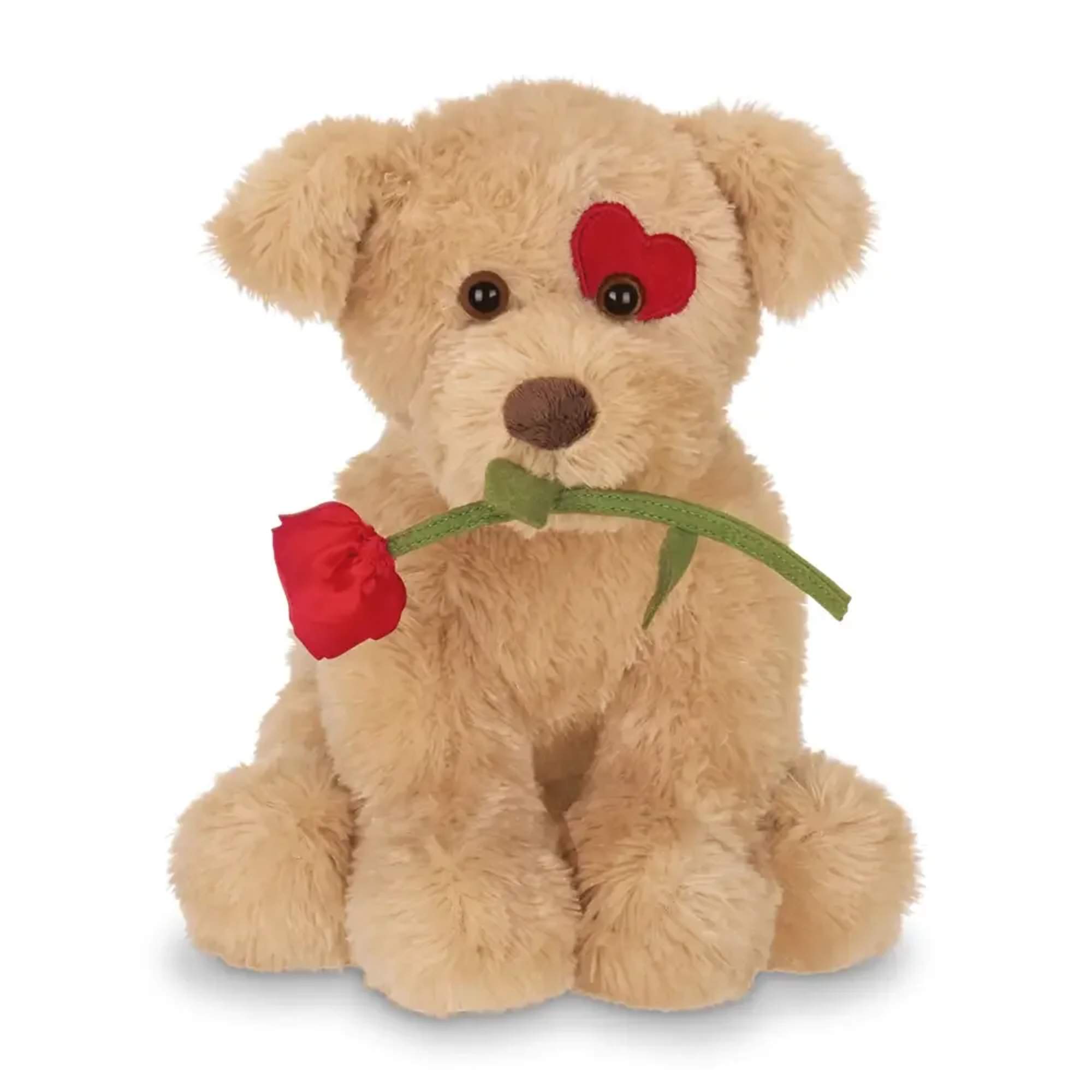 Cute plush teddy bear holding a rose