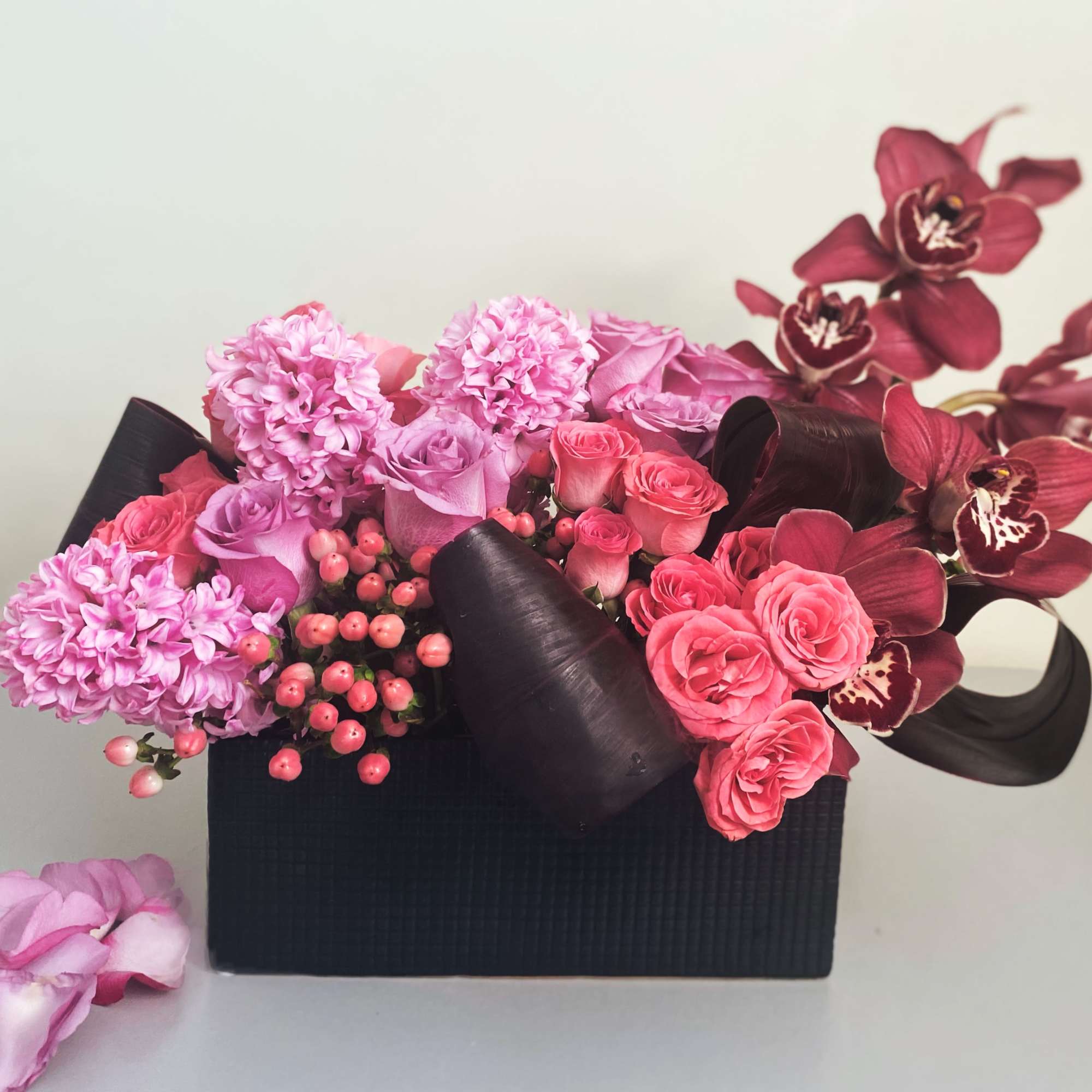 Modern lush design of pinks corals, lavender and burgundy in a sleek