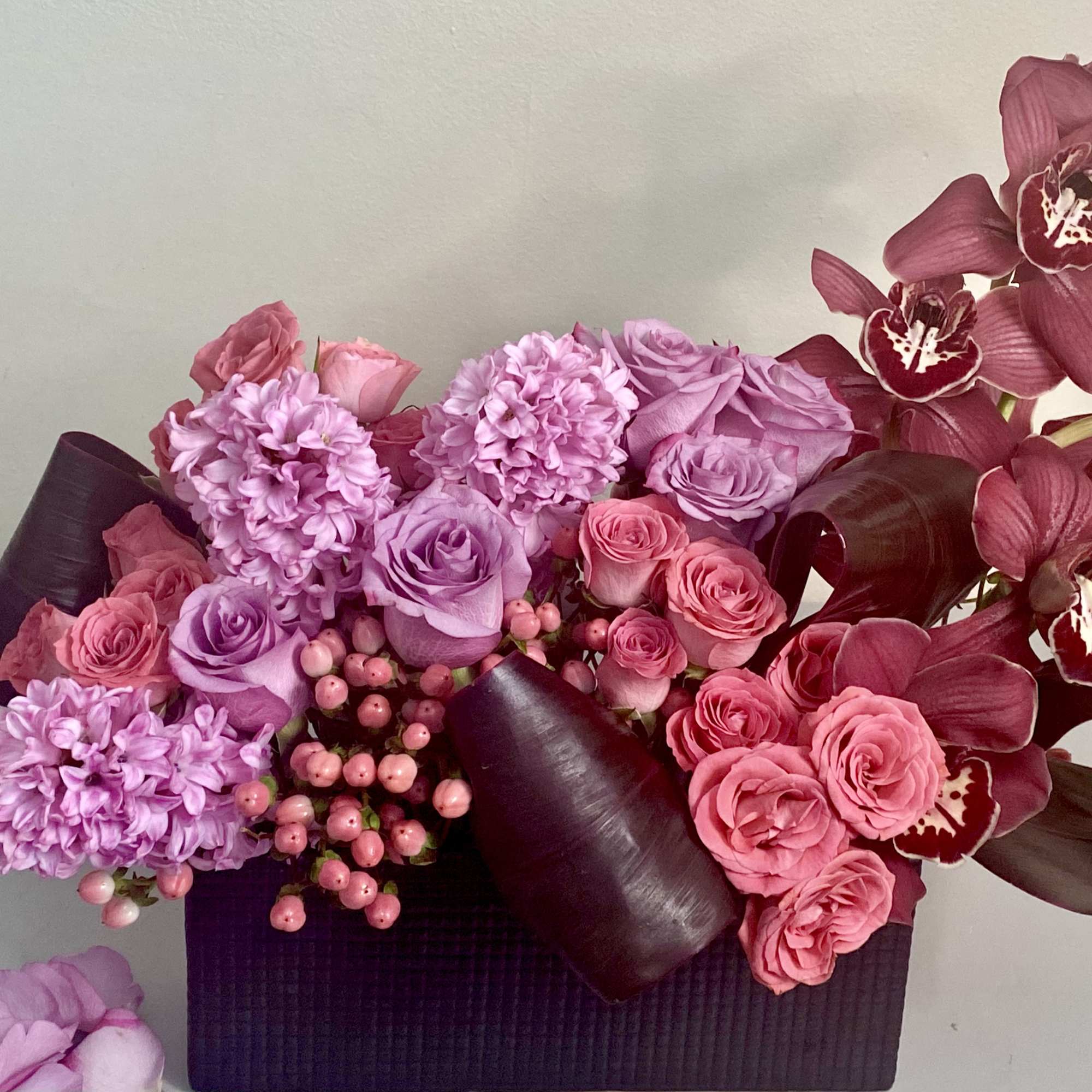 Modern lush design of pinks corals, lavender and burgundy in a sleek
