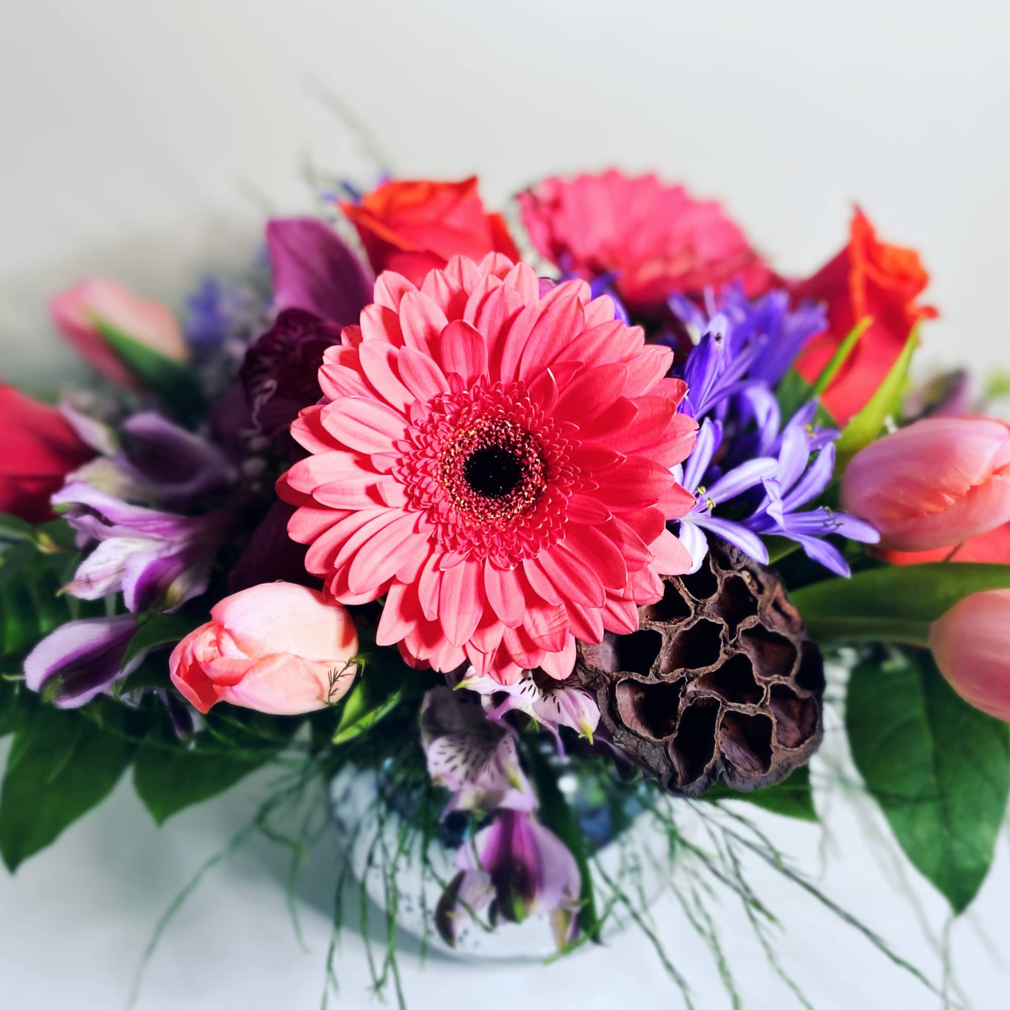 Simple and Elegant Lavender and pink Coral arrangement in silver mercury bowl.