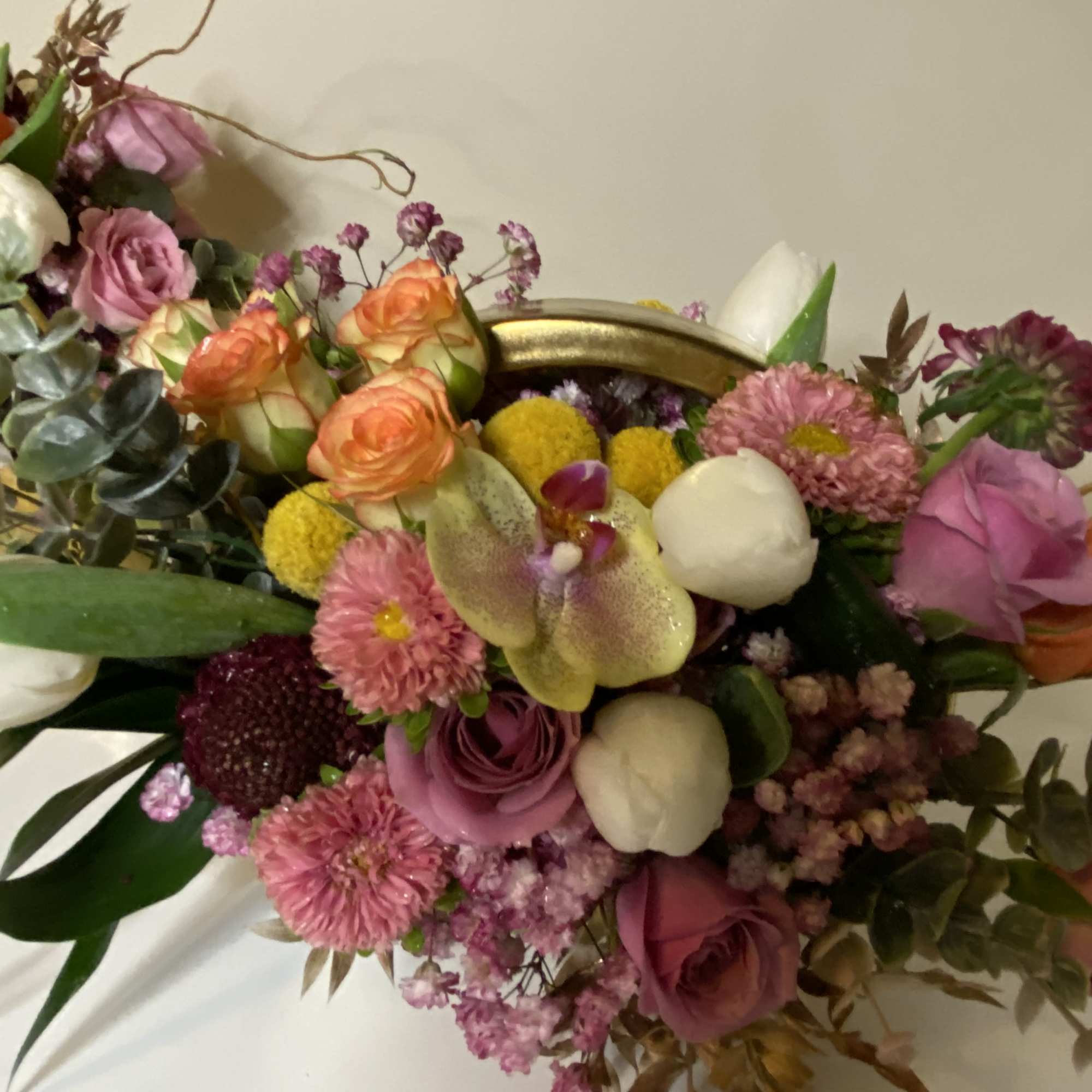 Gold vase with vibrant and happy hues mixed with a touch of