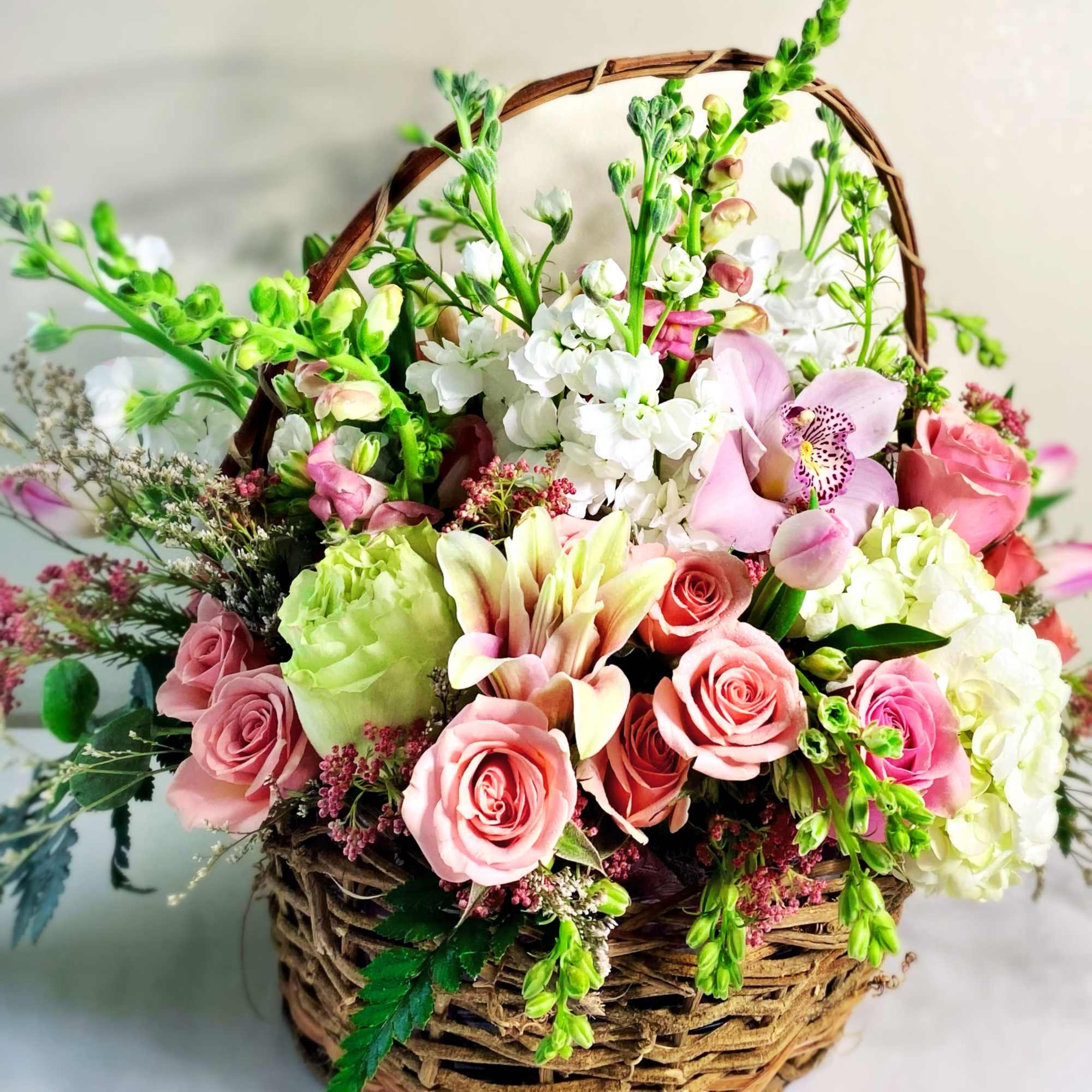 Darling Spring basket is a floral shape of pinks, white and a