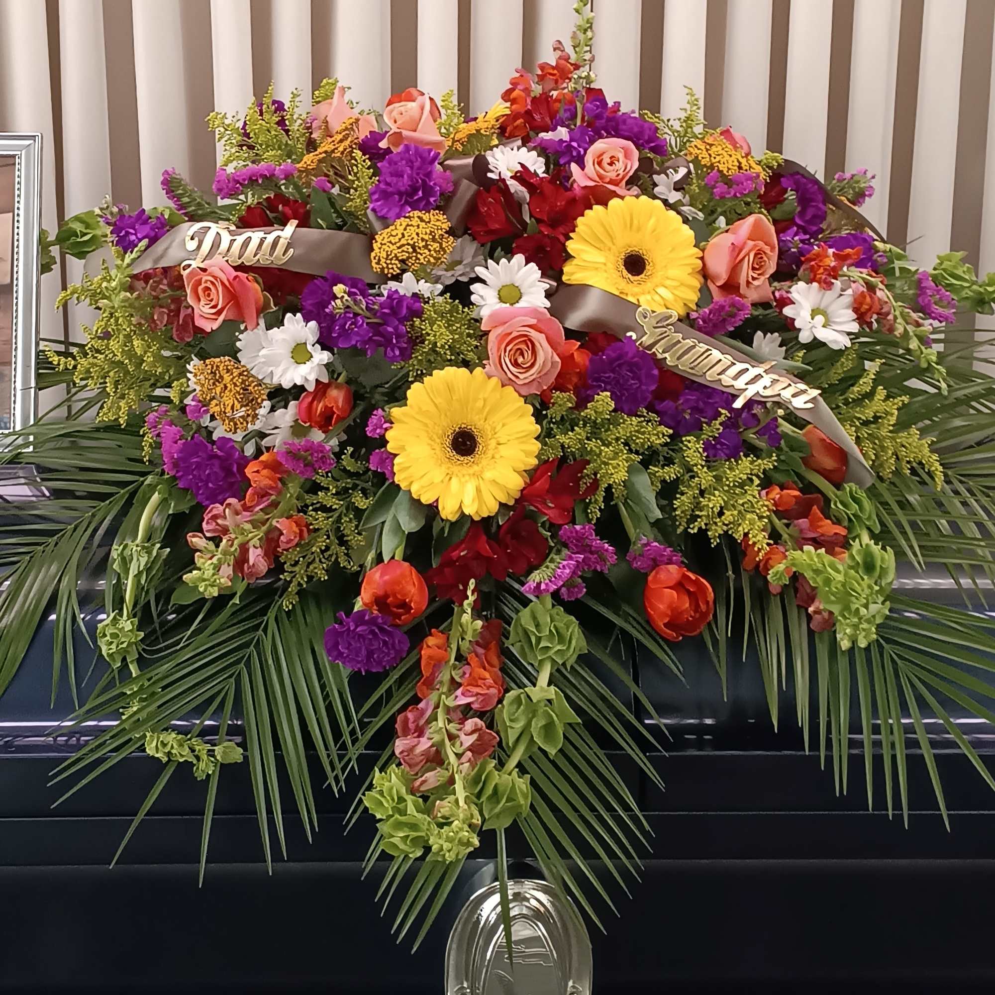 A breathtaking symphony of colors, our Colorful Casket Spray is a radiant