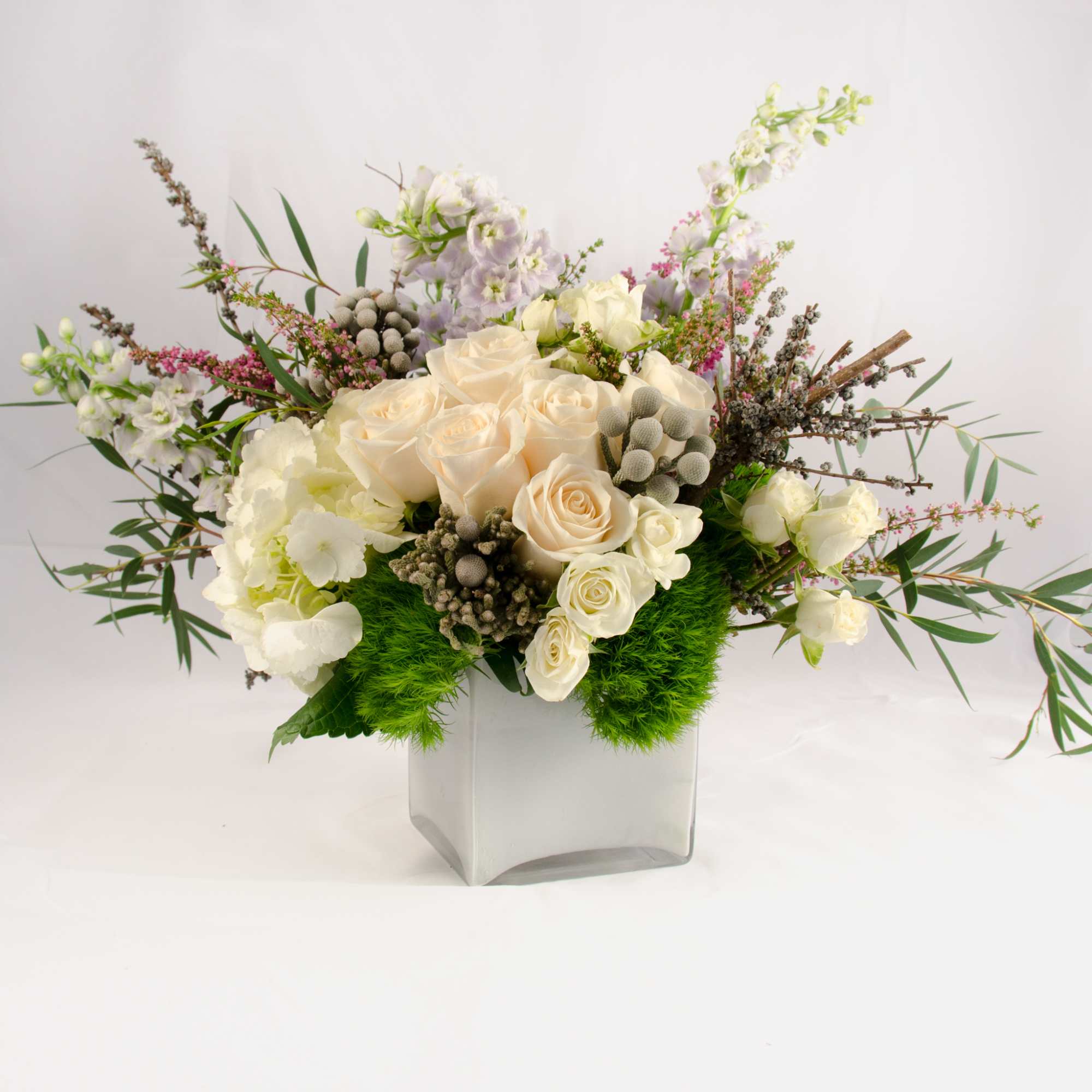 A grand gesture arrangement with soft color palette for any special occasions.