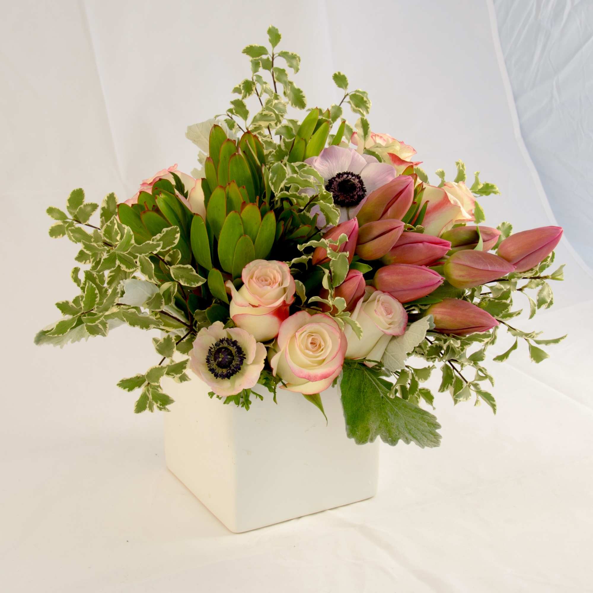 A garden look with Spring to Summer flowers; roses, tulips, anemone, wax