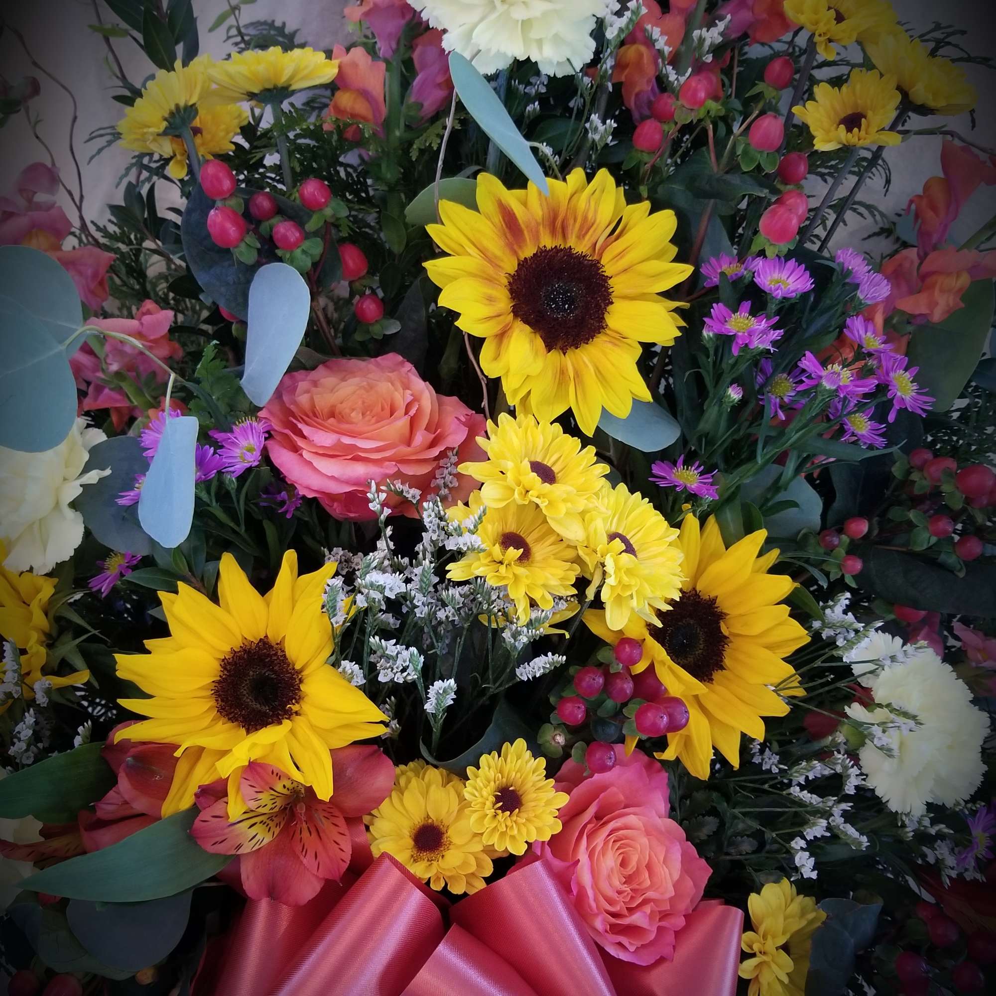 Exuberant colors arranged in a traditional English garden style in a wicker