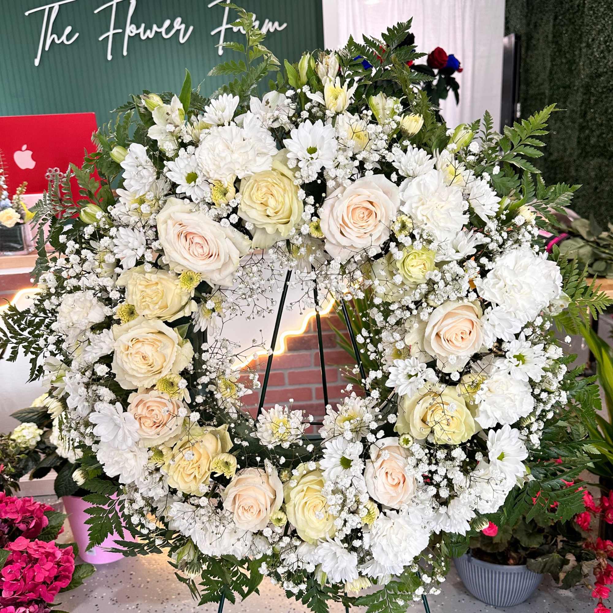  This elegant white wreath spray embodies purity and tranquility, making it