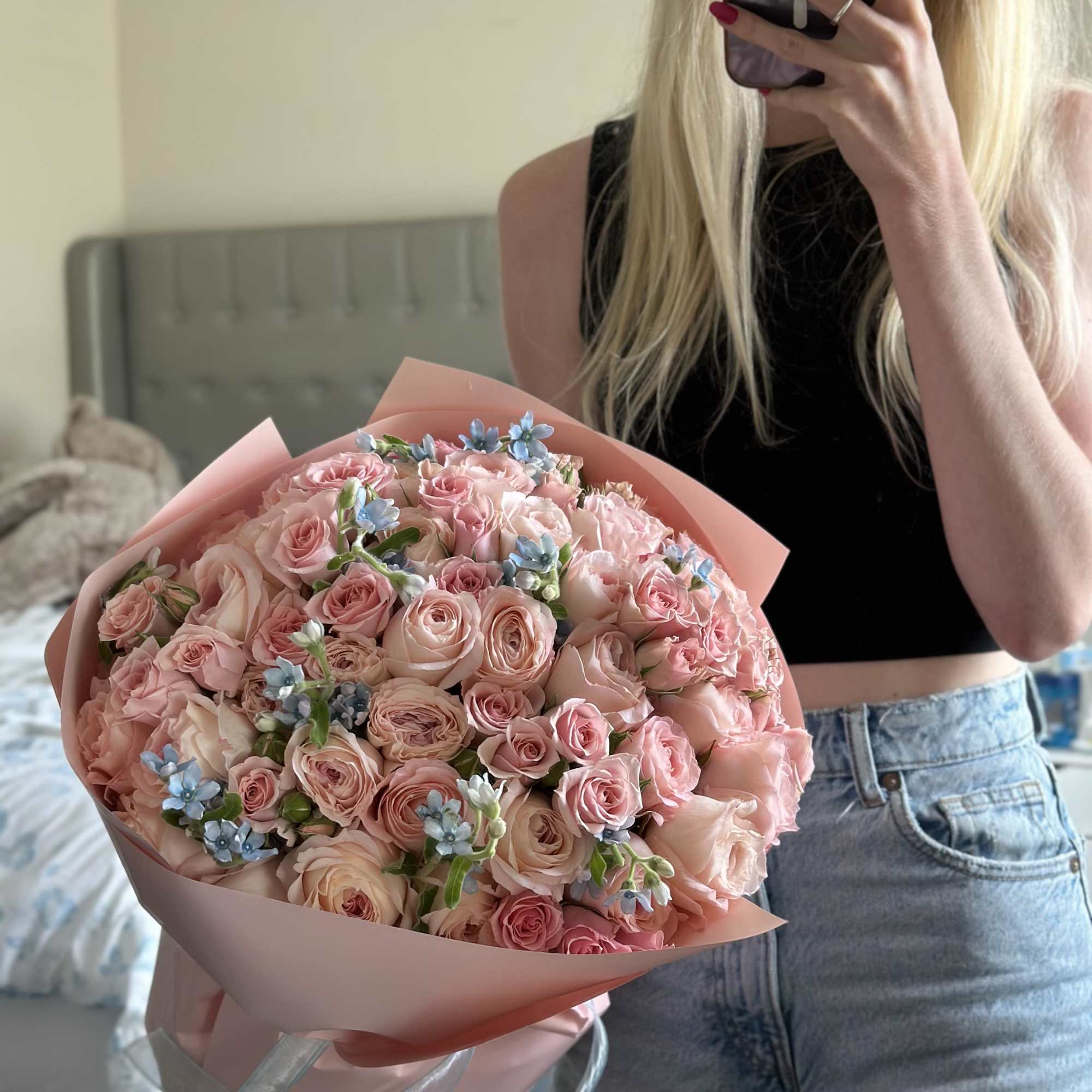 A romantic blend of blush roses and soft pastel blooms, highlighted by