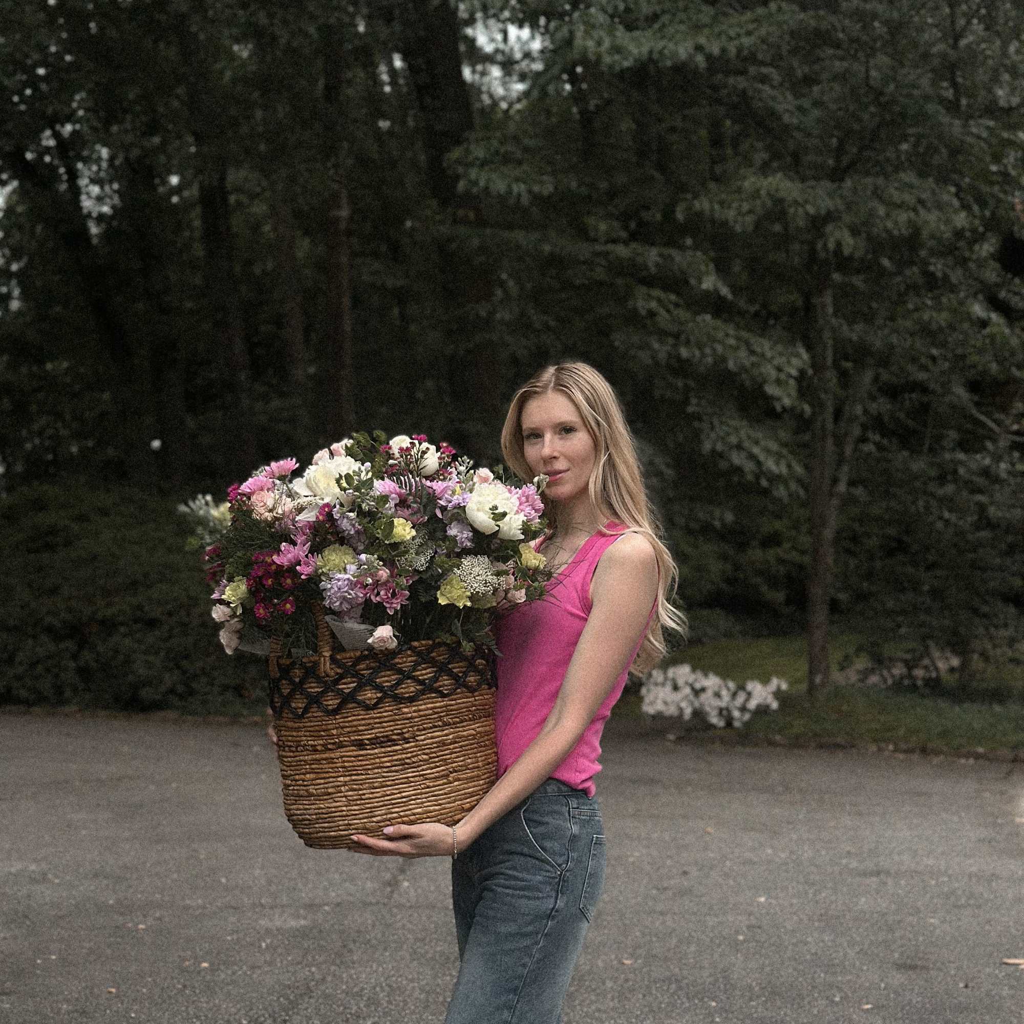 An enchanting garden-style basket filled with vibrant blooms, inspired by the charm
