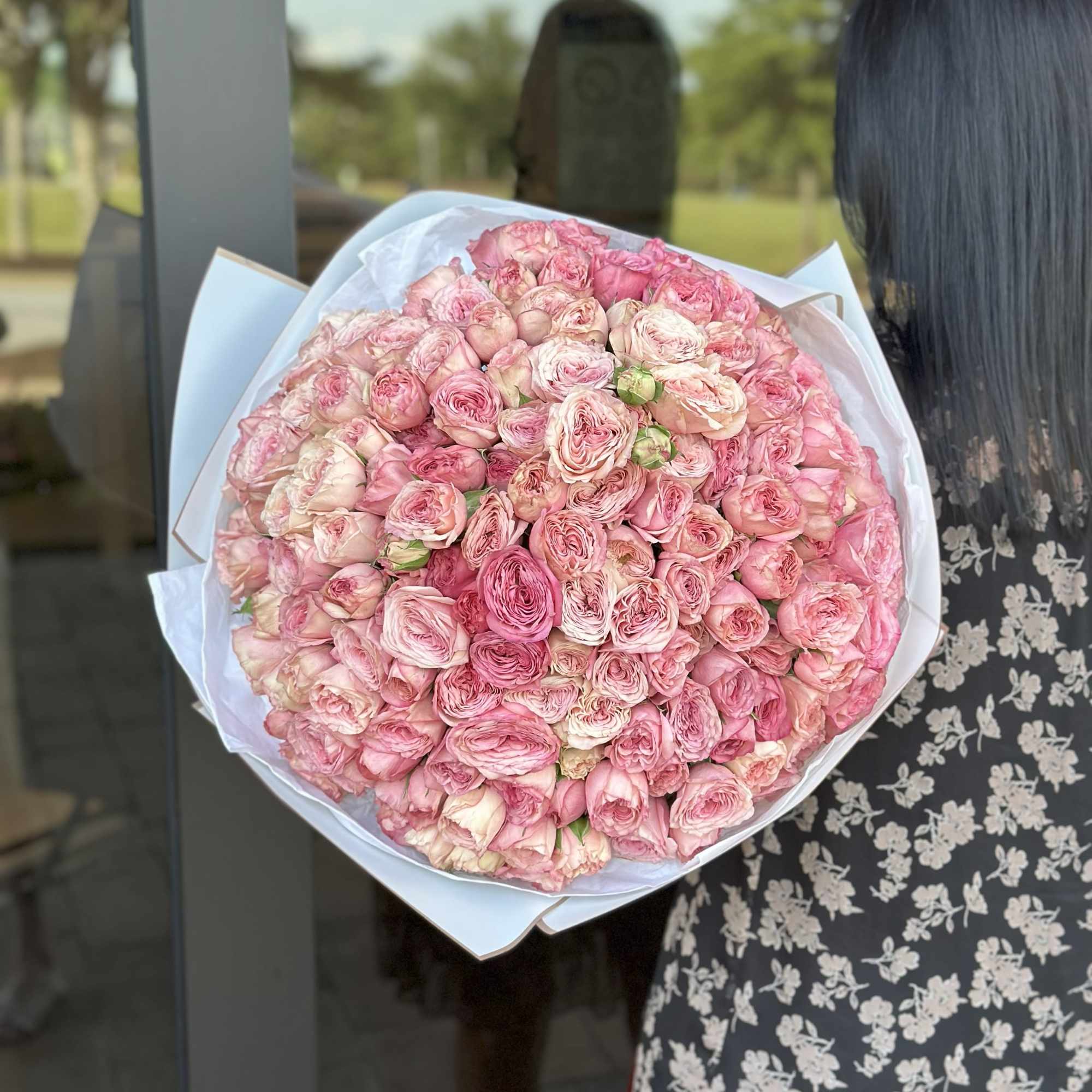 A breathtaking bouquet of lush garden roses in tender shades of pink