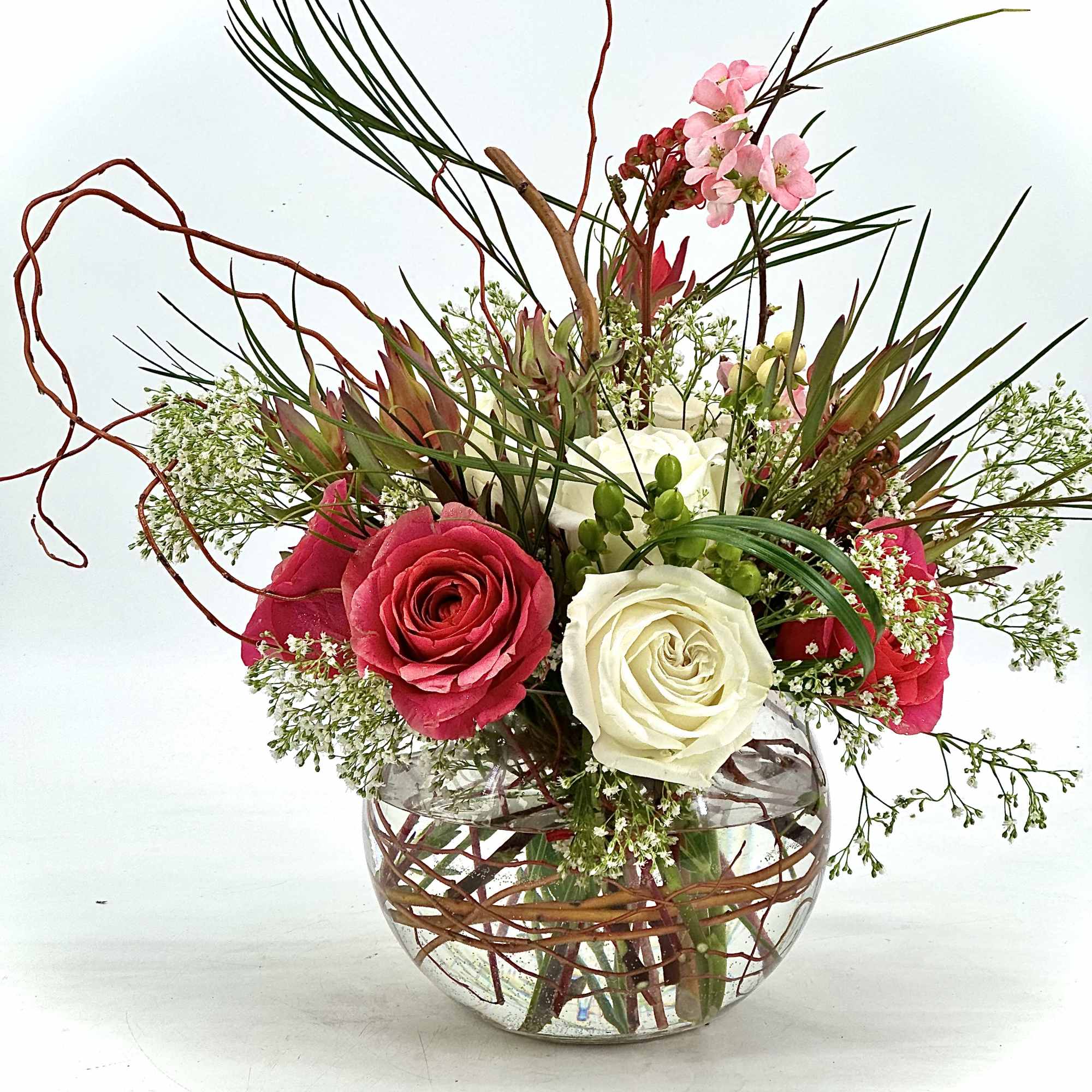 A beautiful handcrafted design round globe floral arrangement, designed  with balance