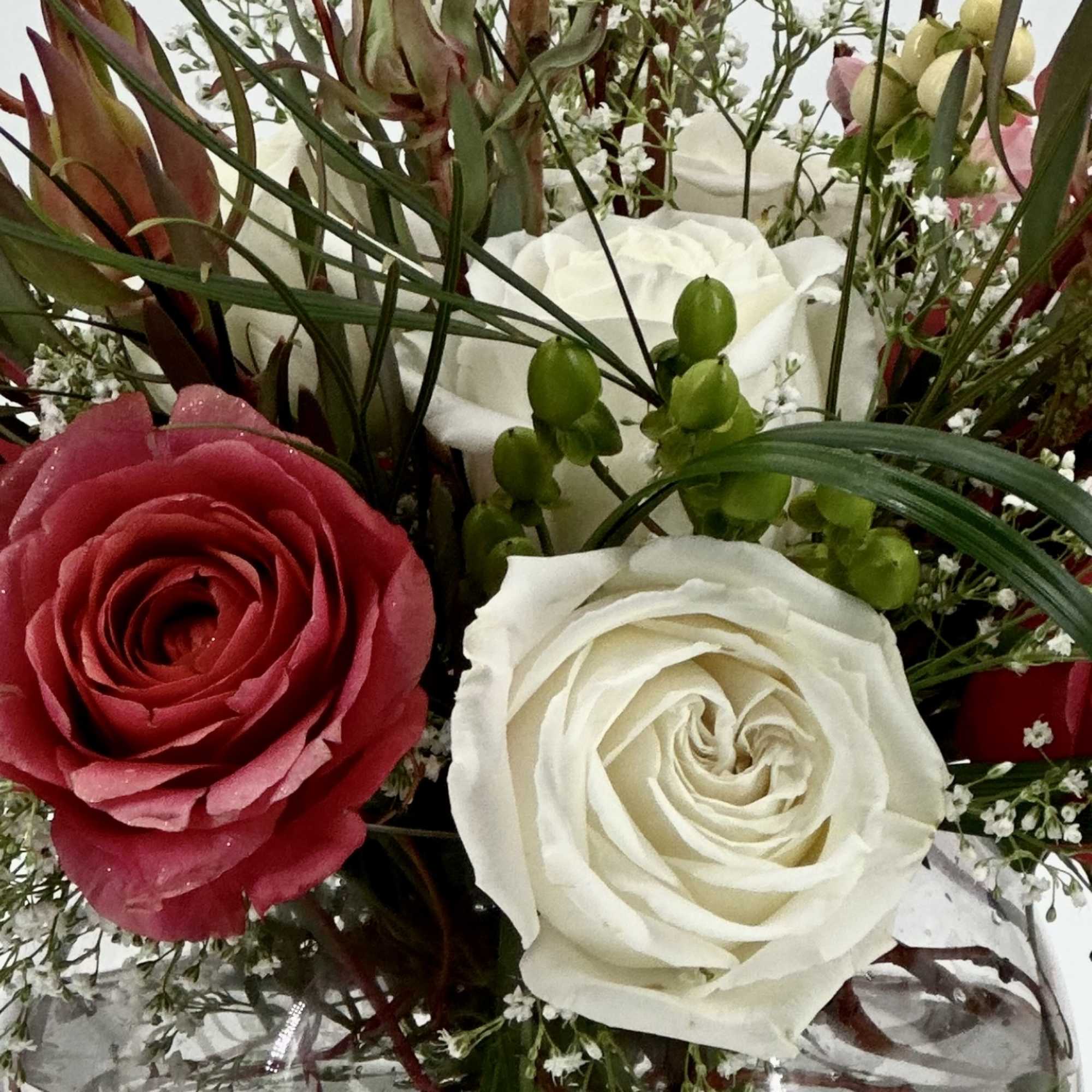 A beautiful handcrafted design round globe floral arrangement, designed  with balance