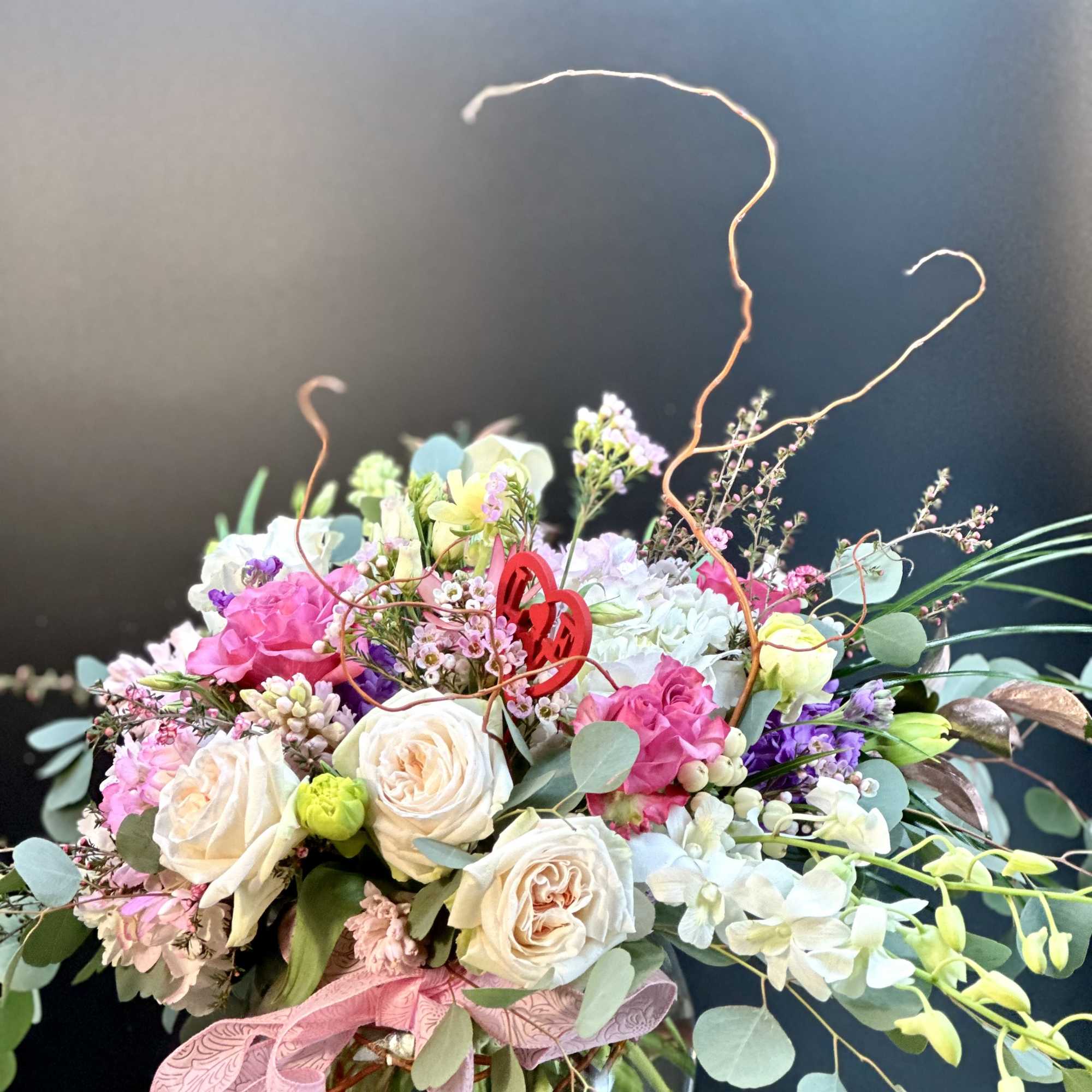 A beautiful handcrafted design round globe floral arrangement, designed  with balance