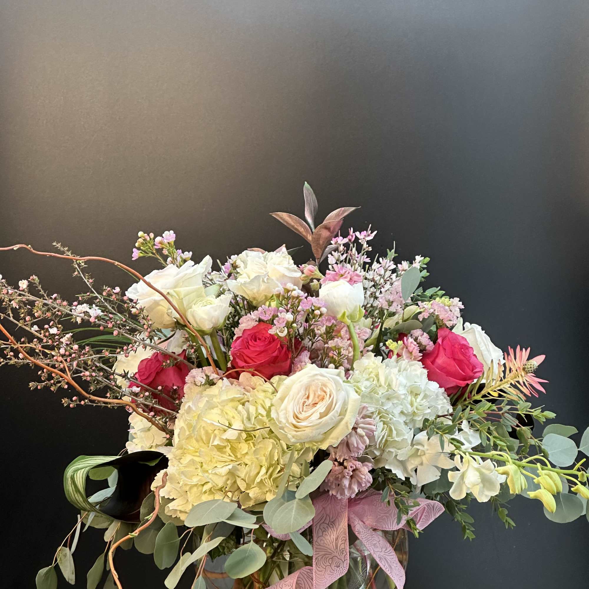 A beautiful handcrafted design round globe floral arrangement, designed  with balance