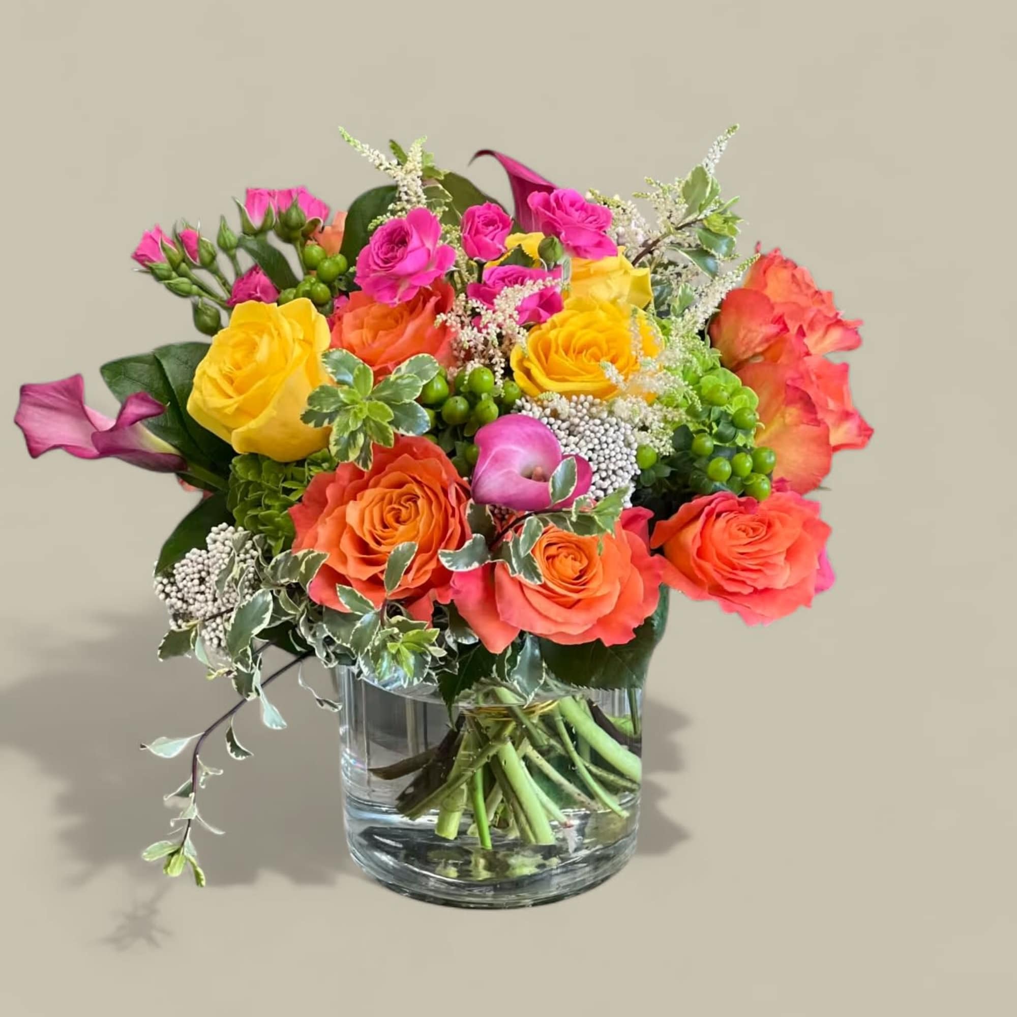 This petite, colorful floral arrangement is a great way to bring a