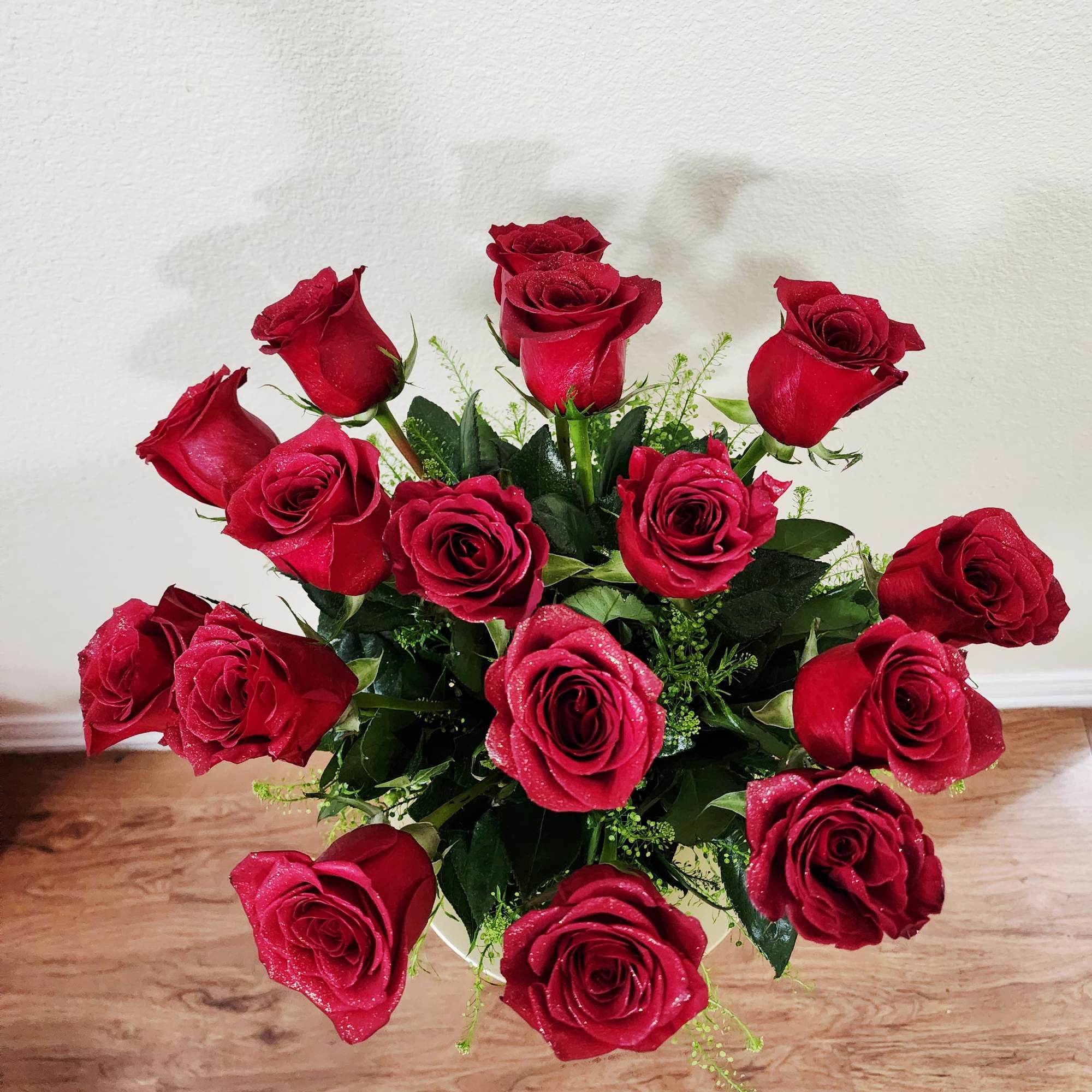 A captivating blend of passion and elegance; deep crimson roses nestled in
