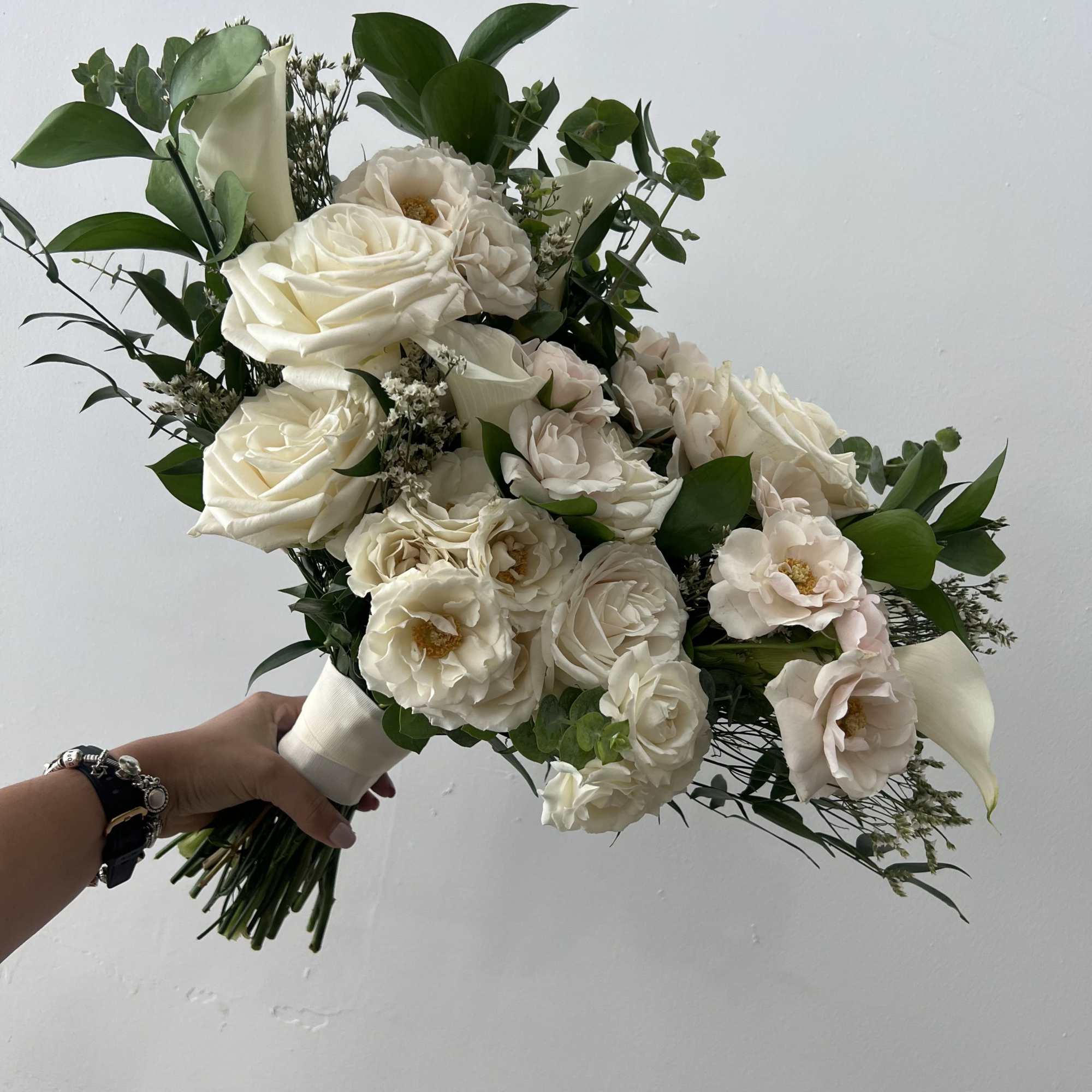 Timeless Ivory is a romantic hand-tied bouquet designed for the modern bride