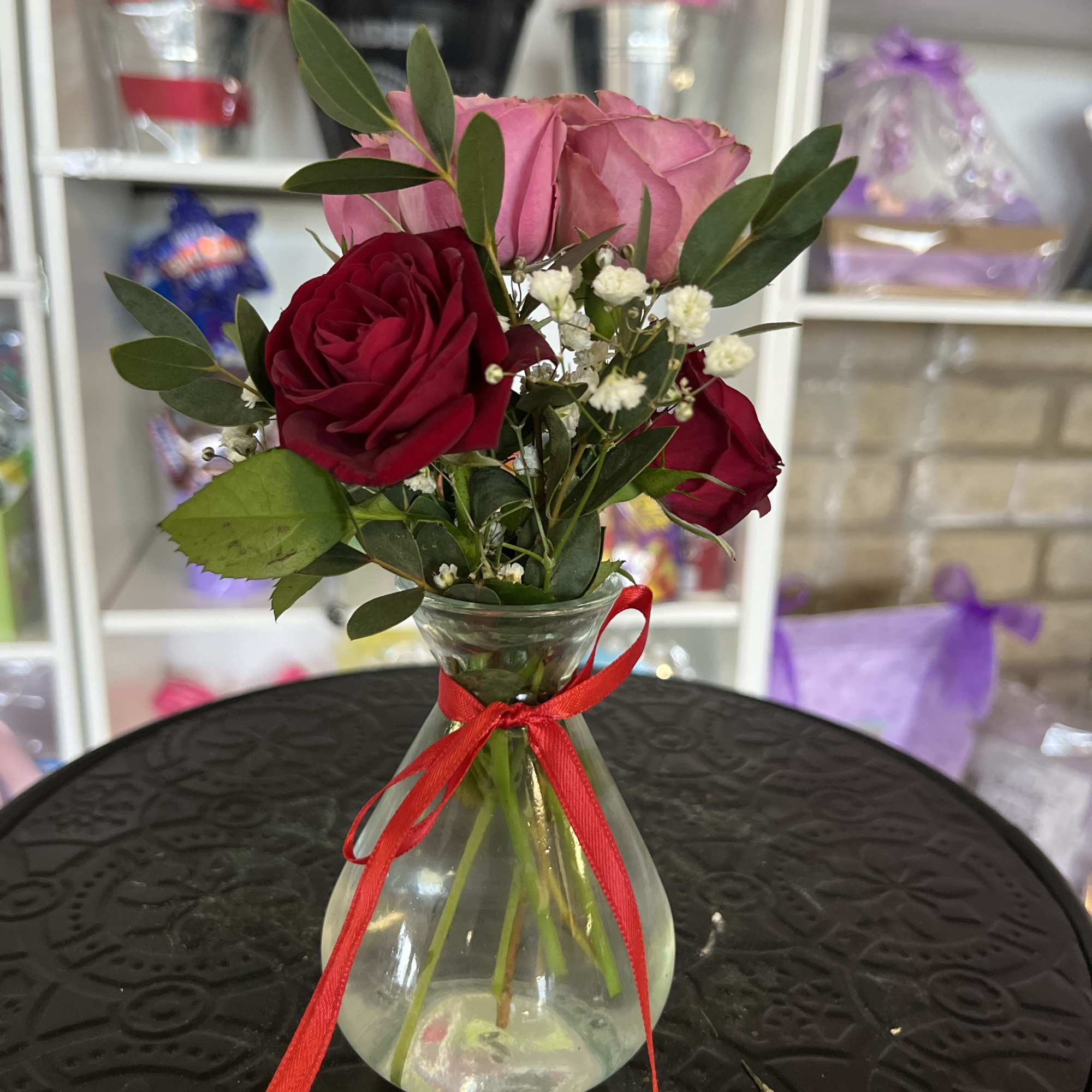 fresh spray roses in small vase 