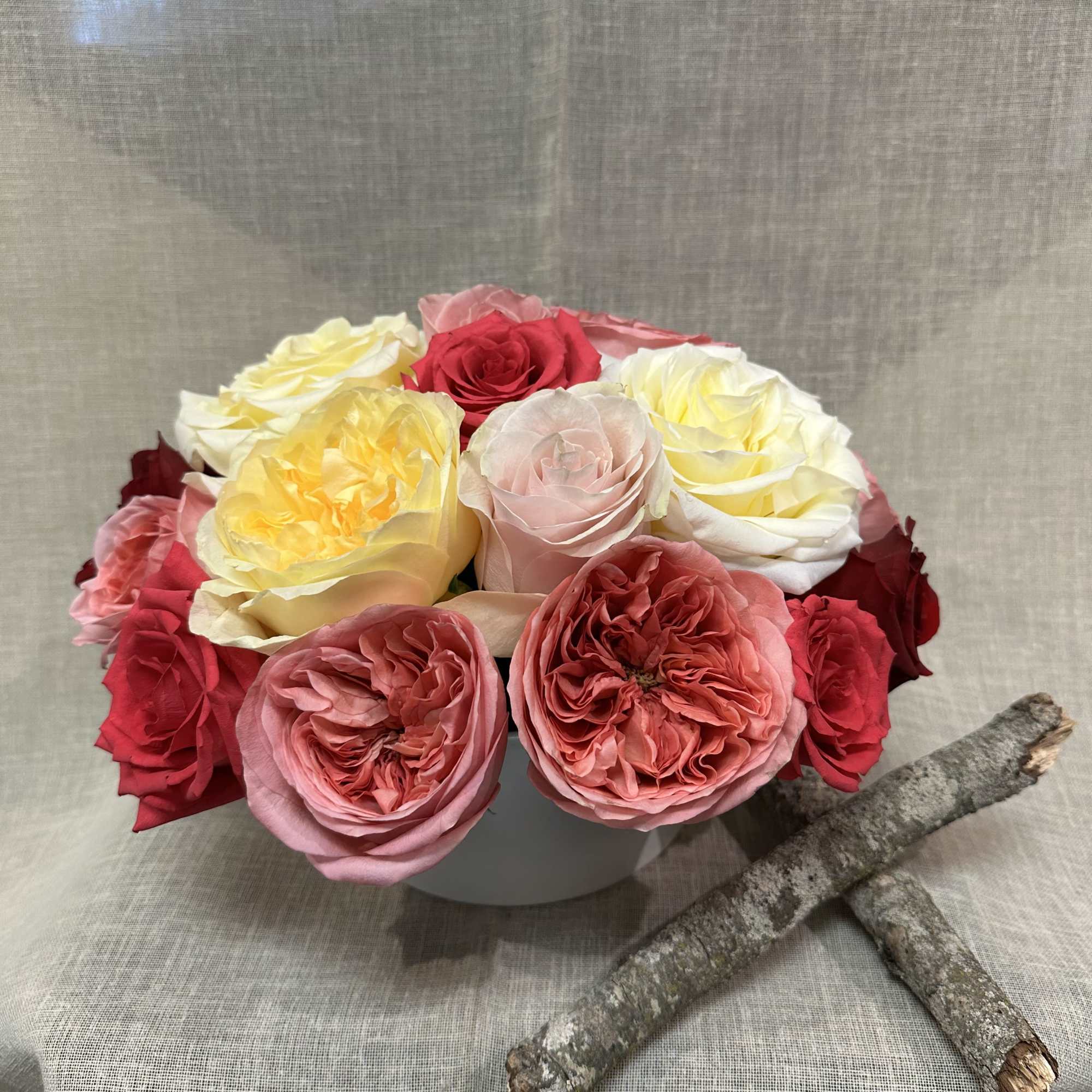 An exquisite variety of Garden roses. and regular roses in a white