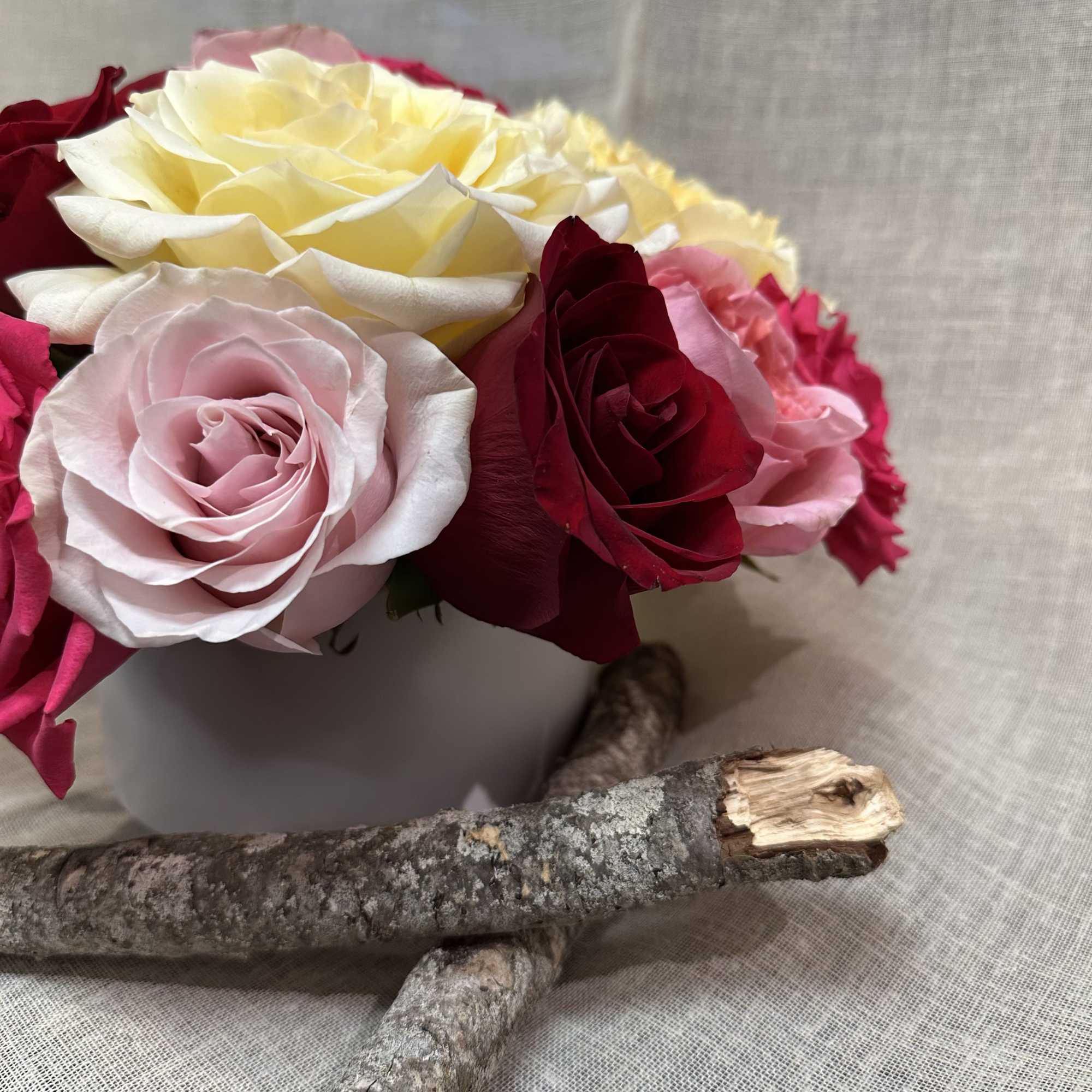 An exquisite variety of Garden roses. and regular roses in a white