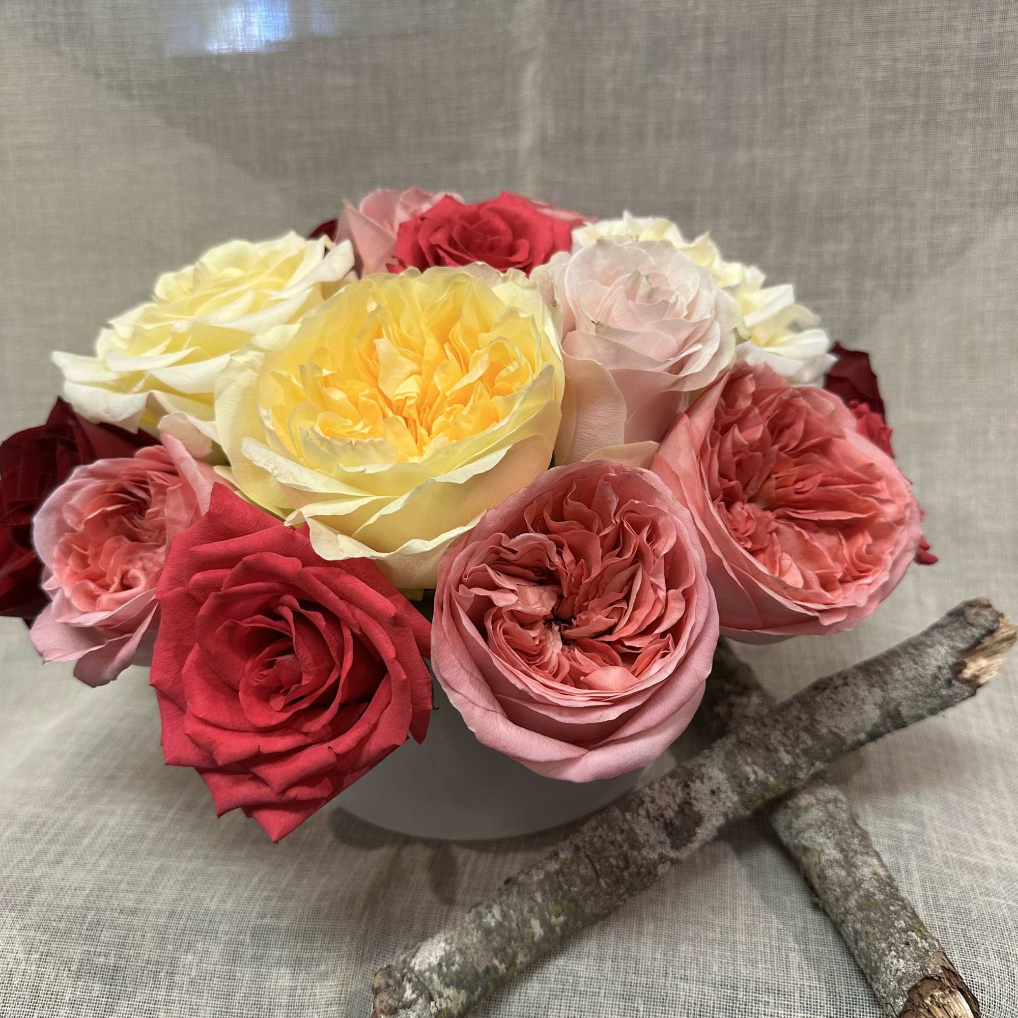 An exquisite variety of Garden roses. and regular roses in a white