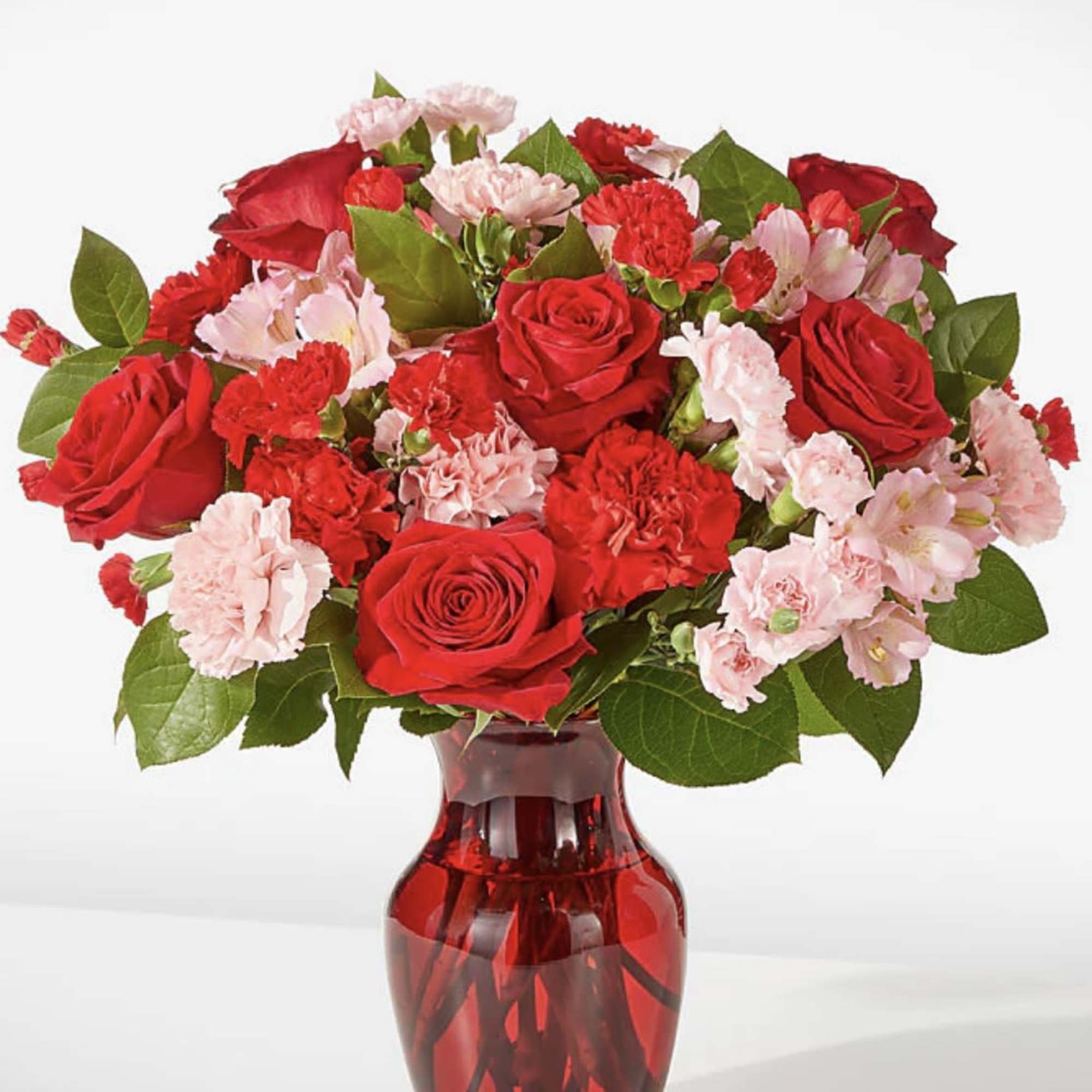 As sweet as candy, this pink and red arrangement is sure to