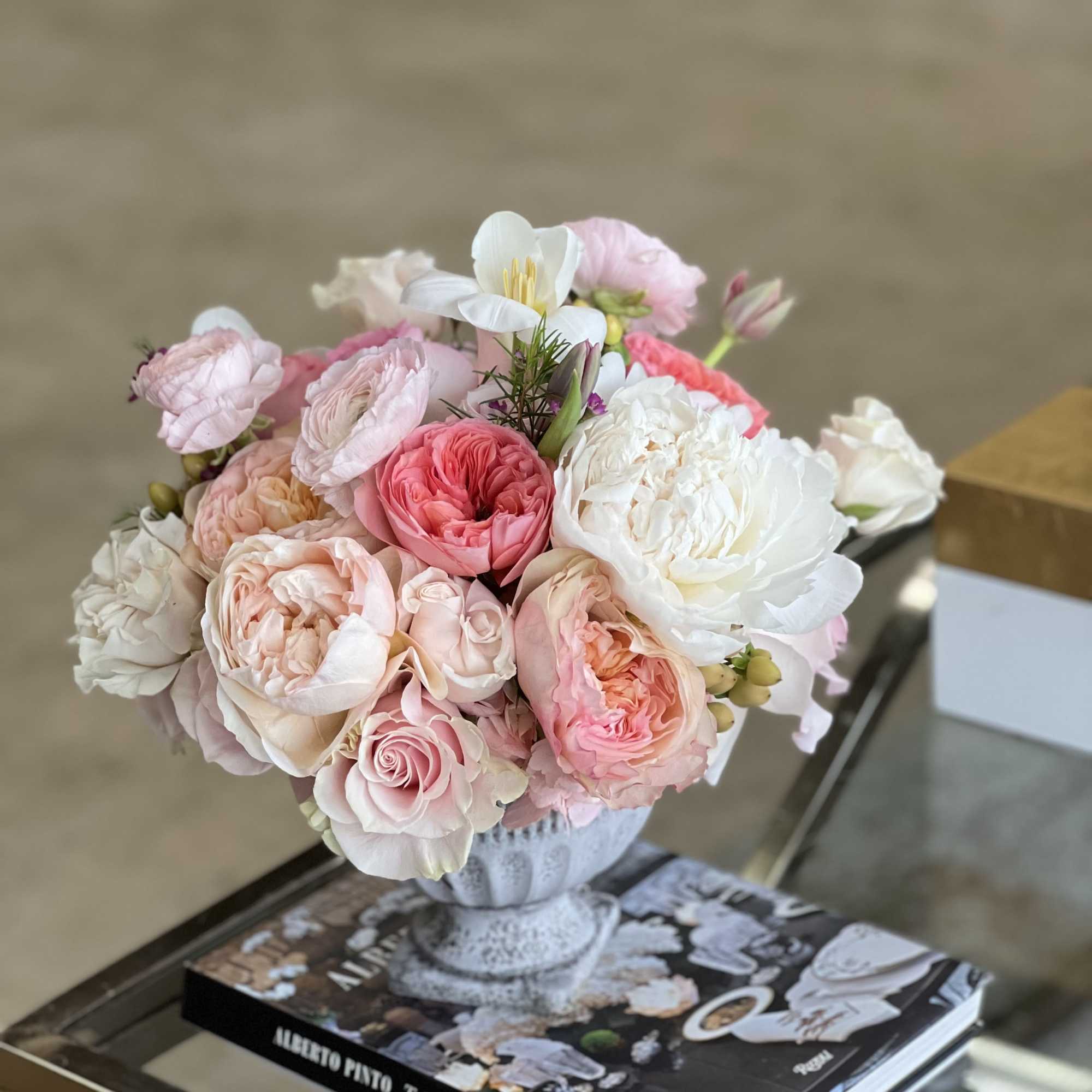 A soft blend of blooms, including Roses, Garden Roses, Peonies, Tulips, and