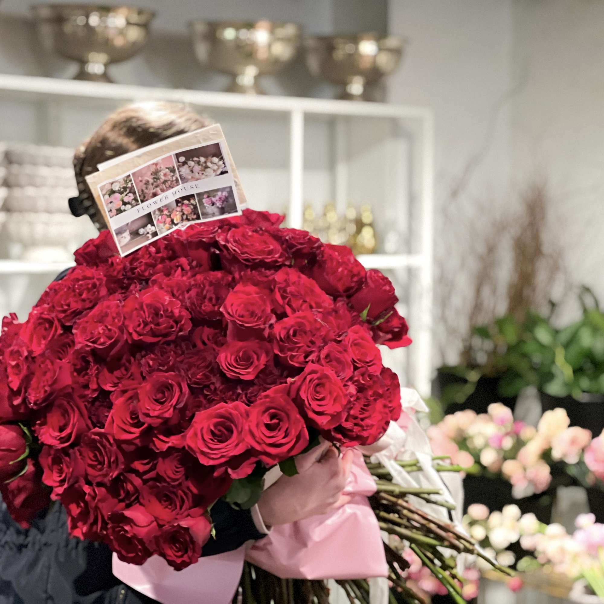 A stunning bouquet of 100 red roses wrapped. 
(Vase Not included) 

Arrangement