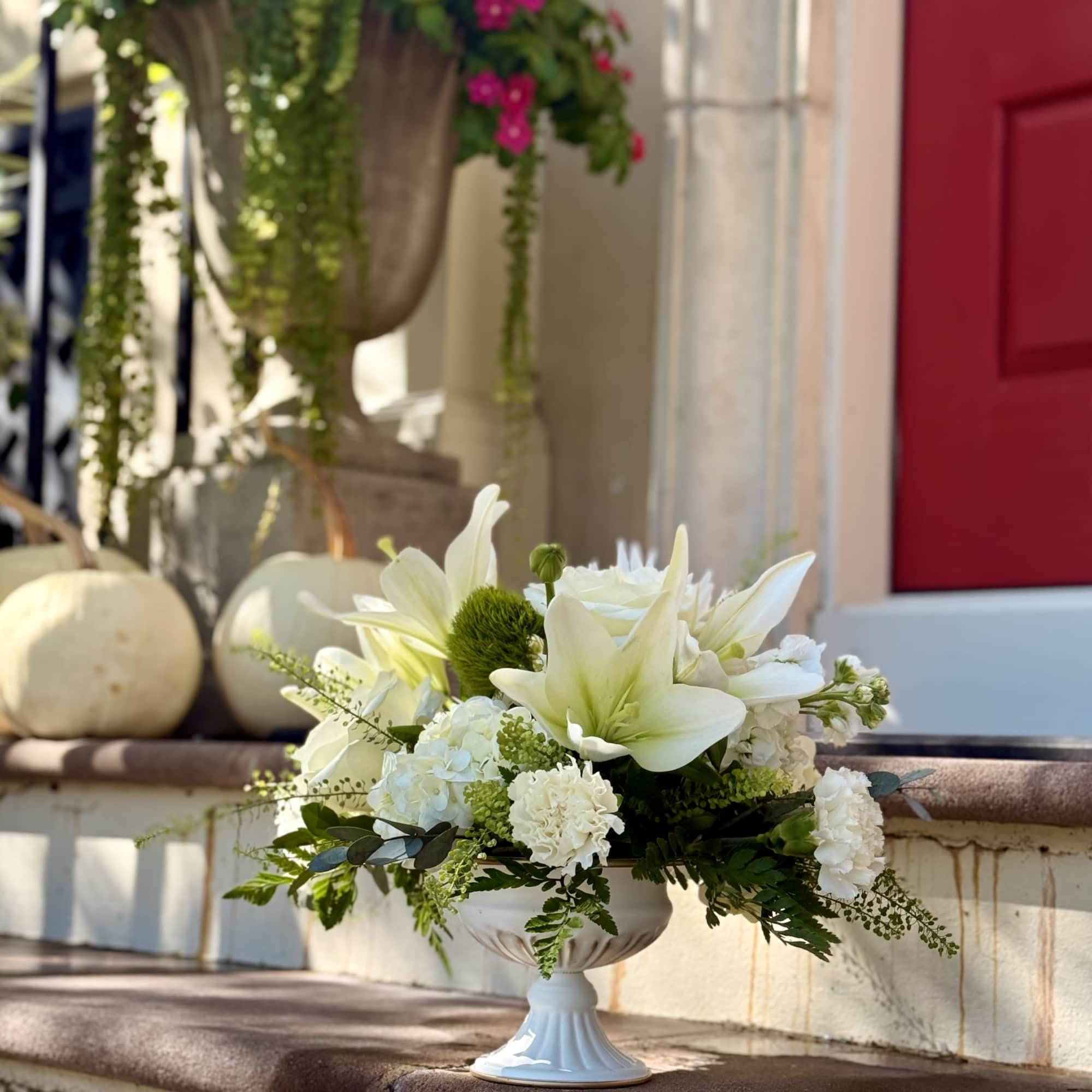 An all white and green floral design for moments that deserve a