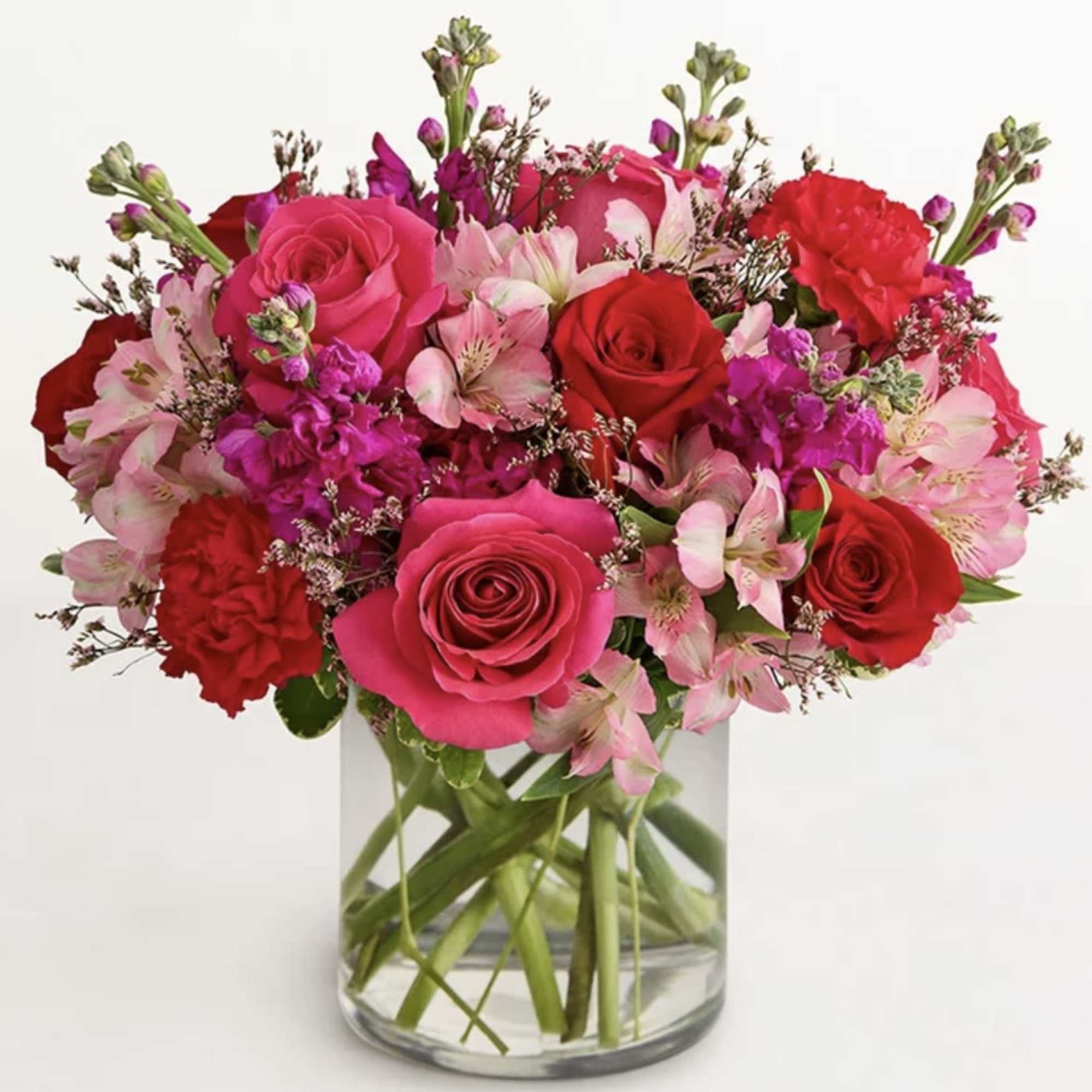 all-around arrangement reds and pinks, designed in a clear glass cylinder vase.
standard/deluxe