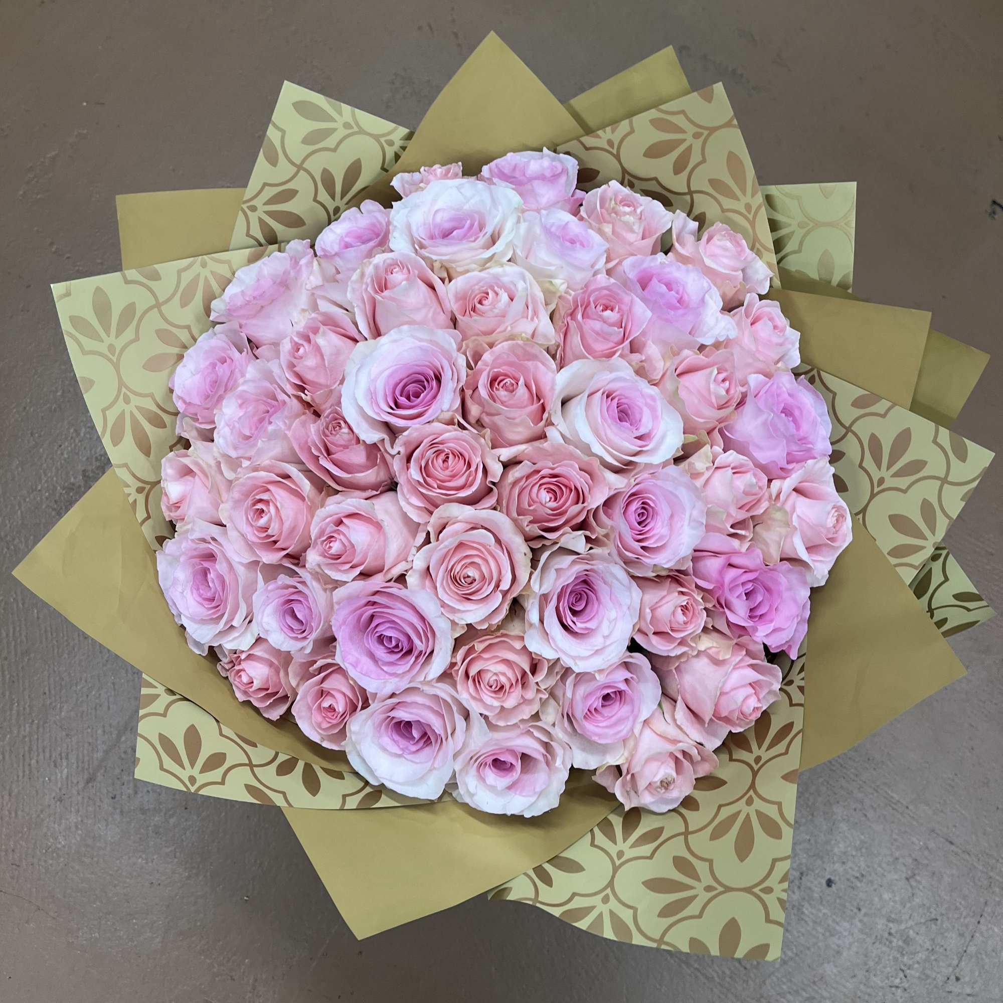 A refined rose bouquet featuring soft pink roses arranged in a nice