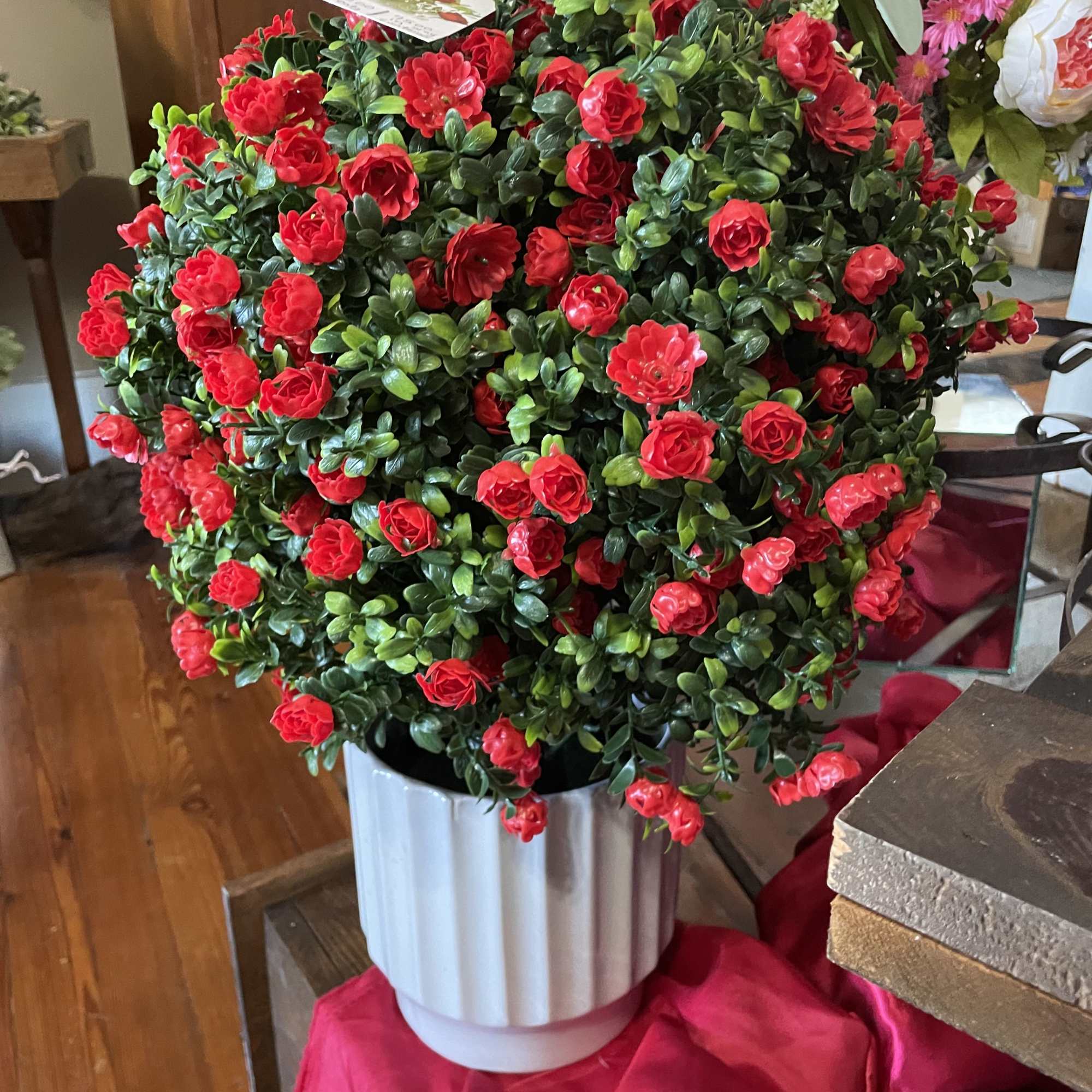 Brighten up a space with this lovely SILK  red rose bush