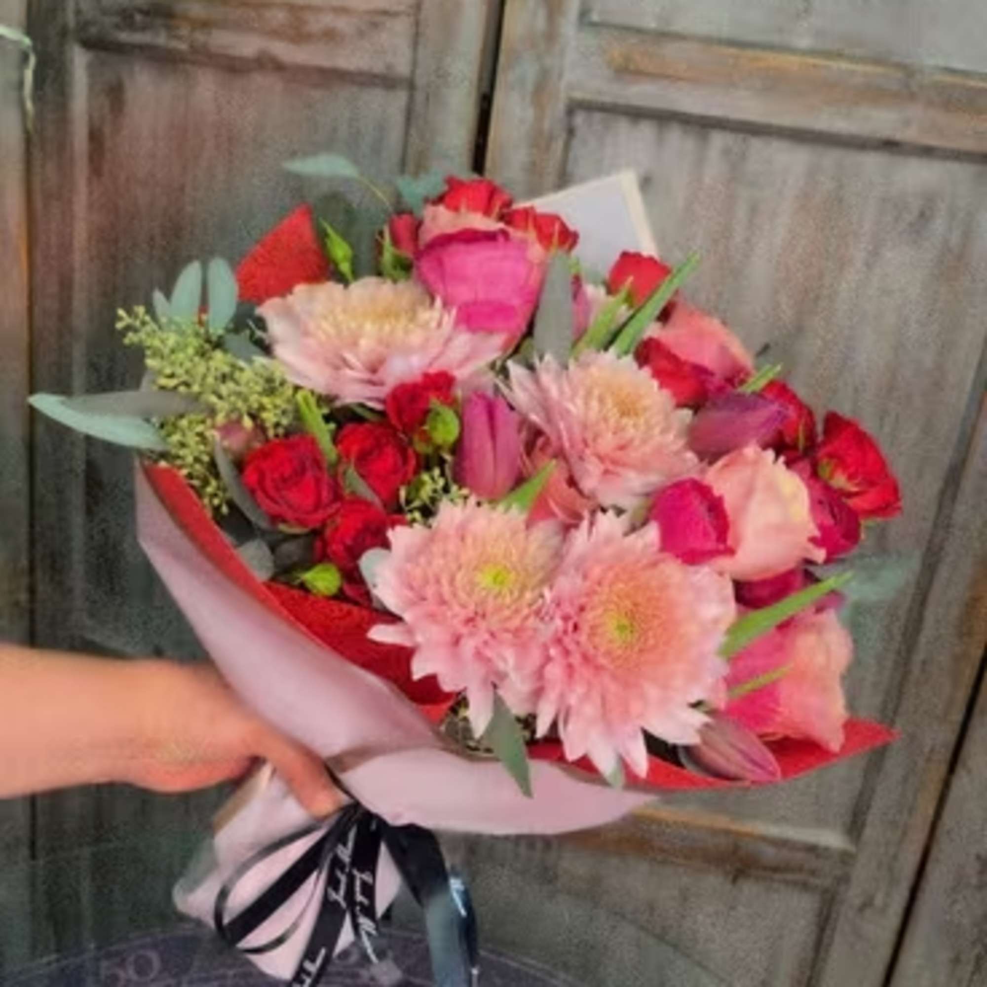 Our Valentine's Day wrapped bouquet is mix of red, white and pink